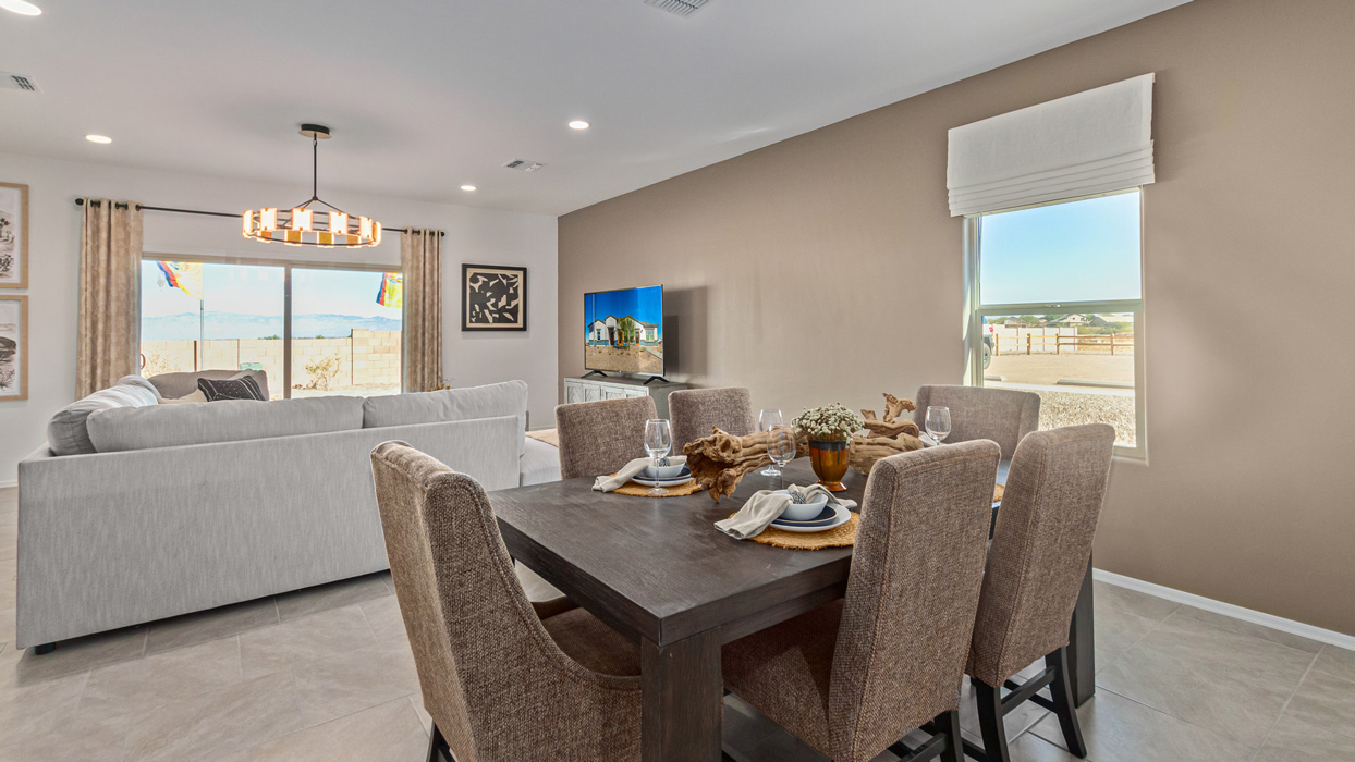 Welcome to the Kingston, a premier new home design situated in the picturesque Sycamore Vista community in Vail, Arizona. With an expansive 2,051 square feet of living space, this single-story home offers four bedrooms, two bathrooms, and a two-three car garage.  As you step inside, you are greeted by an inviting entryway that flows seamlessly into a heart of the home. The open-concept kitchen, equipped with a center island, modern appliances, and ample pantry space, makes it ideal for culinary adventures. Adjacent to the kitchen, the dining room offers easy access to the covered patio, where you can enjoy outdoor dining or simply relax in the tranquility of your private backyard.  The Kingston’s thoughtful layout ensures that every bedroom offers comfort and privacy. The primary suite, located at the rear of the home, features a large walk-in closet and an en-suite bathroom. The additional bedrooms are thoughtfully arranged to provide flexibility, whether you need a guest room, home office, or space for hobbies.  The Kingston is built with a focus on energy efficiency, featuring top-of-the-line insulation, energy-efficient appliances, and a smart home package that includes an automated thermostat, keyless entry, a Wi-Fi-enabled garage door opener, and more. This modern home not only offers comfort but also provides peace of mind with its energy-saving features and enhanced security systems.  Residents of Sycamore Vista enjoy a harmonious blend of rural tranquility and convenient urban access. With proximity to outdoor attractions like Coronado National Forest and Colossal Cave Mountain Park, as well as nearby schools and major employers, Sycamore Vista provides a unique living experience where nature and modern living coexist.  The Kingston at Sycamore Vista is more than just a house—it's a place to create lasting memories and live your best life.  *Images shown are for reference only. They depict the sales model home and may not represent the actual home.