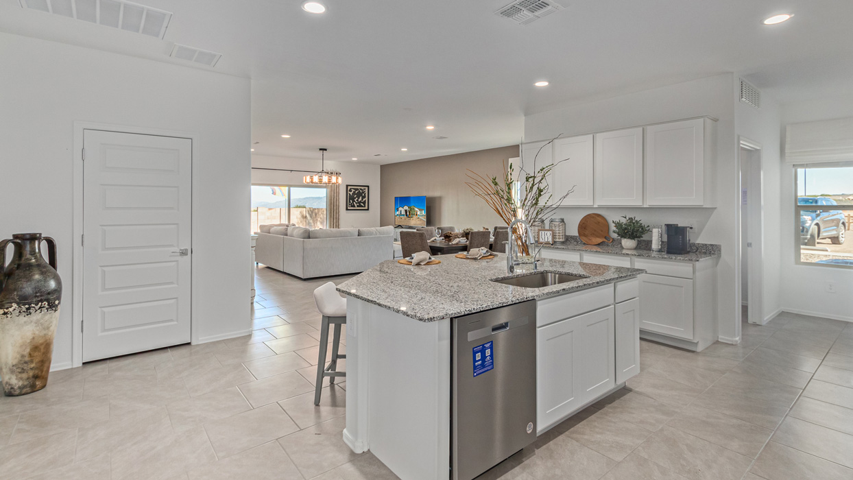 Welcome to the Kingston, a premier new home design situated in the picturesque Sycamore Vista community in Vail, Arizona. With an expansive 2,051 square feet of living space, this single-story home offers four bedrooms, two bathrooms, and a two-three car garage.  As you step inside, you are greeted by an inviting entryway that flows seamlessly into a heart of the home. The open-concept kitchen, equipped with a center island, modern appliances, and ample pantry space, makes it ideal for culinary adventures. Adjacent to the kitchen, the dining room offers easy access to the covered patio, where you can enjoy outdoor dining or simply relax in the tranquility of your private backyard.  The Kingston’s thoughtful layout ensures that every bedroom offers comfort and privacy. The primary suite, located at the rear of the home, features a large walk-in closet and an en-suite bathroom. The additional bedrooms are thoughtfully arranged to provide flexibility, whether you need a guest room, home office, or space for hobbies.  The Kingston is built with a focus on energy efficiency, featuring top-of-the-line insulation, energy-efficient appliances, and a smart home package that includes an automated thermostat, keyless entry, a Wi-Fi-enabled garage door opener, and more. This modern home not only offers comfort but also provides peace of mind with its energy-saving features and enhanced security systems.  Residents of Sycamore Vista enjoy a harmonious blend of rural tranquility and convenient urban access. With proximity to outdoor attractions like Coronado National Forest and Colossal Cave Mountain Park, as well as nearby schools and major employers, Sycamore Vista provides a unique living experience where nature and modern living coexist.  The Kingston at Sycamore Vista is more than just a house—it's a place to create lasting memories and live your best life.  *Images shown are for reference only. They depict the sales model home and may not represent the actual home.