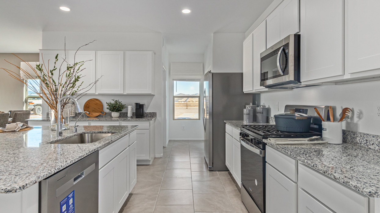 Welcome to the Kingston, a premier new home design situated in the picturesque Sycamore Vista community in Vail, Arizona. With an expansive 2,051 square feet of living space, this single-story home offers four bedrooms, two bathrooms, and a two-three car garage.  As you step inside, you are greeted by an inviting entryway that flows seamlessly into a heart of the home. The open-concept kitchen, equipped with a center island, modern appliances, and ample pantry space, makes it ideal for culinary adventures. Adjacent to the kitchen, the dining room offers easy access to the covered patio, where you can enjoy outdoor dining or simply relax in the tranquility of your private backyard.  The Kingston’s thoughtful layout ensures that every bedroom offers comfort and privacy. The primary suite, located at the rear of the home, features a large walk-in closet and an en-suite bathroom. The additional bedrooms are thoughtfully arranged to provide flexibility, whether you need a guest room, home office, or space for hobbies.  The Kingston is built with a focus on energy efficiency, featuring top-of-the-line insulation, energy-efficient appliances, and a smart home package that includes an automated thermostat, keyless entry, a Wi-Fi-enabled garage door opener, and more. This modern home not only offers comfort but also provides peace of mind with its energy-saving features and enhanced security systems.  Residents of Sycamore Vista enjoy a harmonious blend of rural tranquility and convenient urban access. With proximity to outdoor attractions like Coronado National Forest and Colossal Cave Mountain Park, as well as nearby schools and major employers, Sycamore Vista provides a unique living experience where nature and modern living coexist.  The Kingston at Sycamore Vista is more than just a house—it's a place to create lasting memories and live your best life.  *Images shown are for reference only. They depict the sales model home and may not represent the actual home.