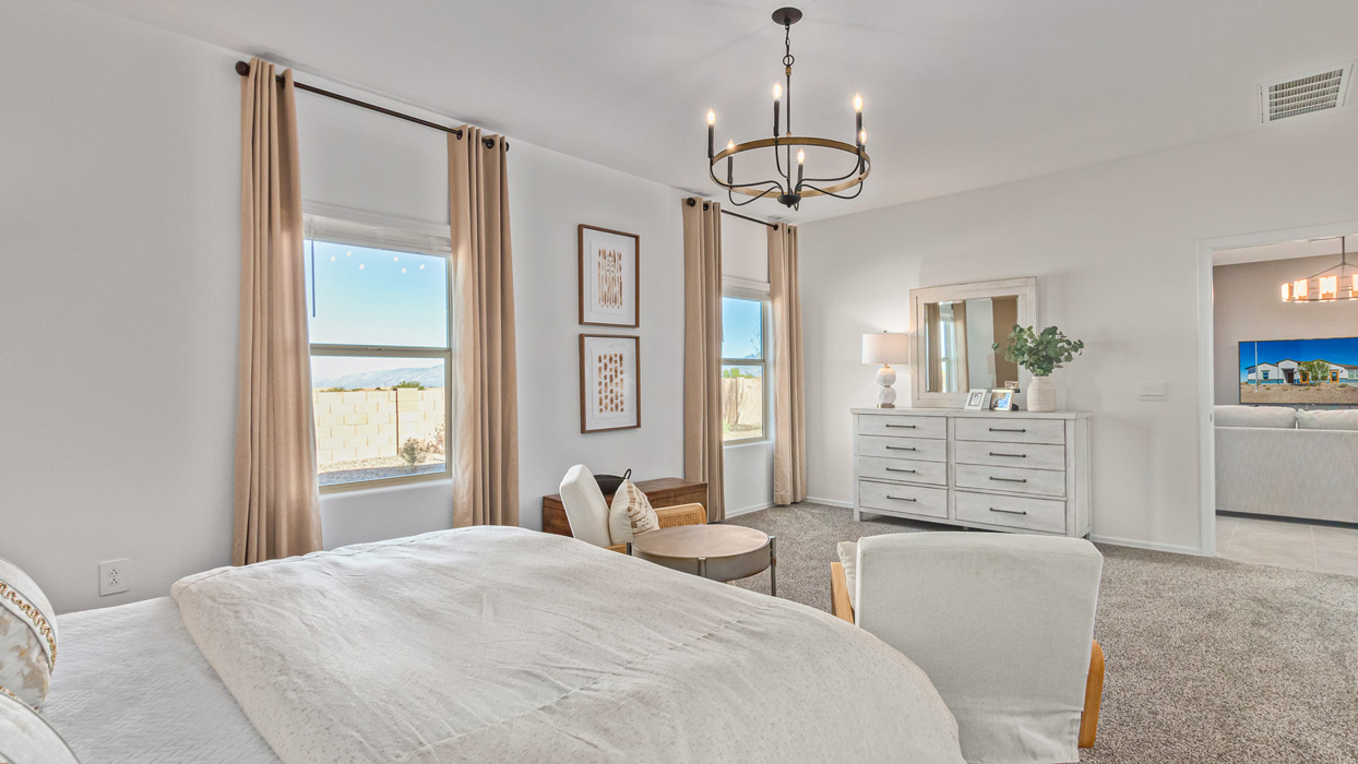 Welcome to the Kingston, a premier new home design situated in the picturesque Sycamore Vista community in Vail, Arizona. With an expansive 2,051 square feet of living space, this single-story home offers four bedrooms, two bathrooms, and a two-three car garage.  As you step inside, you are greeted by an inviting entryway that flows seamlessly into a heart of the home. The open-concept kitchen, equipped with a center island, modern appliances, and ample pantry space, makes it ideal for culinary adventures. Adjacent to the kitchen, the dining room offers easy access to the covered patio, where you can enjoy outdoor dining or simply relax in the tranquility of your private backyard.  The Kingston’s thoughtful layout ensures that every bedroom offers comfort and privacy. The primary suite, located at the rear of the home, features a large walk-in closet and an en-suite bathroom. The additional bedrooms are thoughtfully arranged to provide flexibility, whether you need a guest room, home office, or space for hobbies.  The Kingston is built with a focus on energy efficiency, featuring top-of-the-line insulation, energy-efficient appliances, and a smart home package that includes an automated thermostat, keyless entry, a Wi-Fi-enabled garage door opener, and more. This modern home not only offers comfort but also provides peace of mind with its energy-saving features and enhanced security systems.  Residents of Sycamore Vista enjoy a harmonious blend of rural tranquility and convenient urban access. With proximity to outdoor attractions like Coronado National Forest and Colossal Cave Mountain Park, as well as nearby schools and major employers, Sycamore Vista provides a unique living experience where nature and modern living coexist.  The Kingston at Sycamore Vista is more than just a house—it's a place to create lasting memories and live your best life.  *Images shown are for reference only. They depict the sales model home and may not represent the actual home.