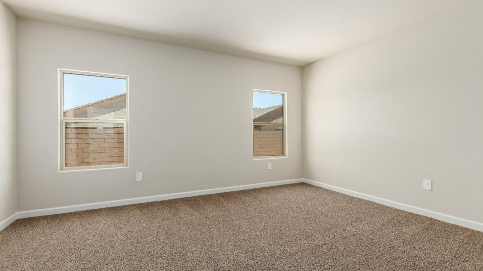 The Lakeway, situated within the beautiful Sycamore Vista community in Vail, Arizona, offers a perfect blend of functionality and comfort, ideal for both growing families and those who appreciate spacious living. With its 2,034 square feet of living space, this single-story new home features five bedrooms and three bathrooms, all meticulously designed to maximize space and convenience.  Entering The Lakeway offers a bright and airy atmosphere that flows through the open-concept floor plan. The heart of the home is the great room, seamlessly connected to the kitchen and dining area. The kitchen is equipped with quartz countertops, Shaker-style cabinetry, and a large island that serves as a focal point for both meal preparation and casual gatherings. The adjoining dining room provides a cozy space for family meals, with easy access to the covered patio through sliding glass doors, creating a wonderful indoor-outdoor living experience.  The primary bedroom is a true retreat, offering a spacious walk-in closet and an en-suite bathroom with a dual-sink vanity and an elegant, tiled shower. The additional bedrooms are thoughtfully spaced to provide ample privacy for family members or guests, and the two secondary bathrooms are finished with modern fixtures and plenty of storage. This home offers a 2-3 car garage option for substantial space of vehicles and storage, accommodating the practical needs of busy households.  Standard features in The Lakeway at Sycamore Vista include energy-efficient elements like a tankless water heater, spray foam insulation, and LED lighting throughout. The home also comes with a Home is Connected® Smart Home package, which includes a smart thermostat, video doorbell, keyless entry, and more, ensuring modern conveniences are at your fingertips. The front yard is beautifully landscaped and includes an auto drip irrigation system, enhancing the curb appeal of this stunning home.  Nestled within Sycamore Vista, The Lakeway combines the tranquility of a rural setting with proximity to excellent schools, shopping, dining, and outdoor recreation, making it an exceptional place to call home.