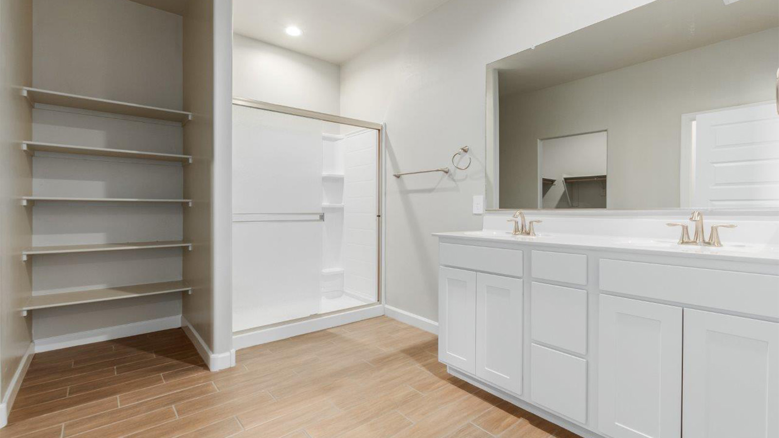 The Lakeway, situated within the beautiful Sycamore Vista community in Vail, Arizona, offers a perfect blend of functionality and comfort, ideal for both growing families and those who appreciate spacious living. With its 2,034 square feet of living space, this single-story new home features five bedrooms and three bathrooms, all meticulously designed to maximize space and convenience.  Entering The Lakeway offers a bright and airy atmosphere that flows through the open-concept floor plan. The heart of the home is the great room, seamlessly connected to the kitchen and dining area. The kitchen is equipped with quartz countertops, Shaker-style cabinetry, and a large island that serves as a focal point for both meal preparation and casual gatherings. The adjoining dining room provides a cozy space for family meals, with easy access to the covered patio through sliding glass doors, creating a wonderful indoor-outdoor living experience.  The primary bedroom is a true retreat, offering a spacious walk-in closet and an en-suite bathroom with a dual-sink vanity and an elegant, tiled shower. The additional bedrooms are thoughtfully spaced to provide ample privacy for family members or guests, and the two secondary bathrooms are finished with modern fixtures and plenty of storage. This home offers a 2-3 car garage option for substantial space of vehicles and storage, accommodating the practical needs of busy households.  Standard features in The Lakeway at Sycamore Vista include energy-efficient elements like a tankless water heater, spray foam insulation, and LED lighting throughout. The home also comes with a Home is Connected® Smart Home package, which includes a smart thermostat, video doorbell, keyless entry, and more, ensuring modern conveniences are at your fingertips. The front yard is beautifully landscaped and includes an auto drip irrigation system, enhancing the curb appeal of this stunning home.  Nestled within Sycamore Vista, The Lakeway combines the tranquility of a rural setting with proximity to excellent schools, shopping, dining, and outdoor recreation, making it an exceptional place to call home.