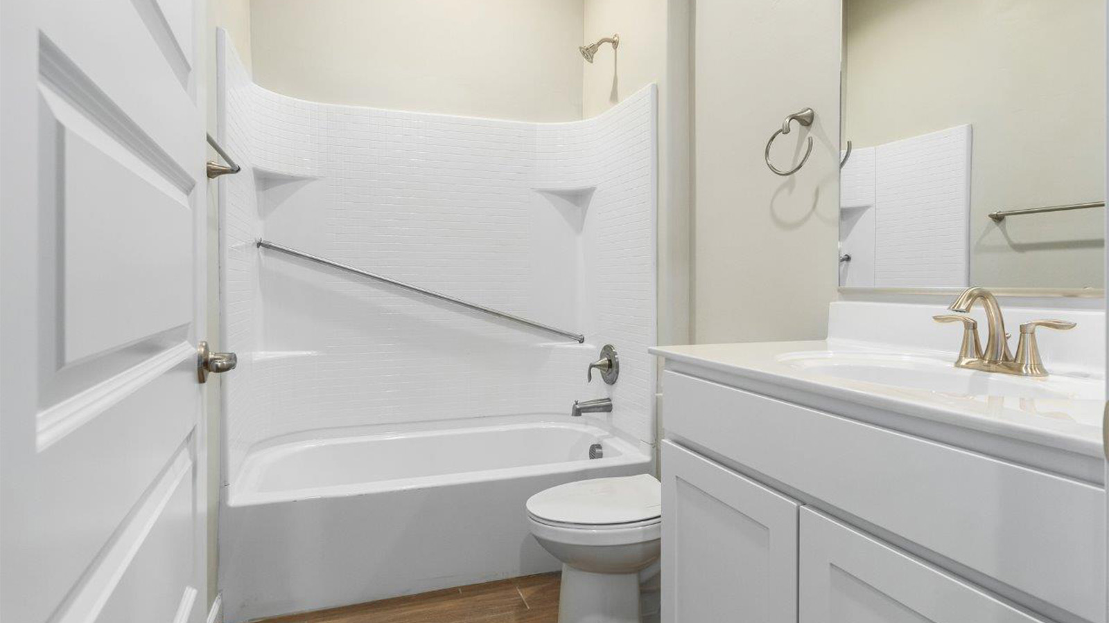 The Lakeway, situated within the beautiful Sycamore Vista community in Vail, Arizona, offers a perfect blend of functionality and comfort, ideal for both growing families and those who appreciate spacious living. With its 2,034 square feet of living space, this single-story new home features five bedrooms and three bathrooms, all meticulously designed to maximize space and convenience.  Entering The Lakeway offers a bright and airy atmosphere that flows through the open-concept floor plan. The heart of the home is the great room, seamlessly connected to the kitchen and dining area. The kitchen is equipped with quartz countertops, Shaker-style cabinetry, and a large island that serves as a focal point for both meal preparation and casual gatherings. The adjoining dining room provides a cozy space for family meals, with easy access to the covered patio through sliding glass doors, creating a wonderful indoor-outdoor living experience.  The primary bedroom is a true retreat, offering a spacious walk-in closet and an en-suite bathroom with a dual-sink vanity and an elegant, tiled shower. The additional bedrooms are thoughtfully spaced to provide ample privacy for family members or guests, and the two secondary bathrooms are finished with modern fixtures and plenty of storage. This home offers a 2-3 car garage option for substantial space of vehicles and storage, accommodating the practical needs of busy households.  Standard features in The Lakeway at Sycamore Vista include energy-efficient elements like a tankless water heater, spray foam insulation, and LED lighting throughout. The home also comes with a Home is Connected® Smart Home package, which includes a smart thermostat, video doorbell, keyless entry, and more, ensuring modern conveniences are at your fingertips. The front yard is beautifully landscaped and includes an auto drip irrigation system, enhancing the curb appeal of this stunning home.  Nestled within Sycamore Vista, The Lakeway combines the tranquility of a rural setting with proximity to excellent schools, shopping, dining, and outdoor recreation, making it an exceptional place to call home.