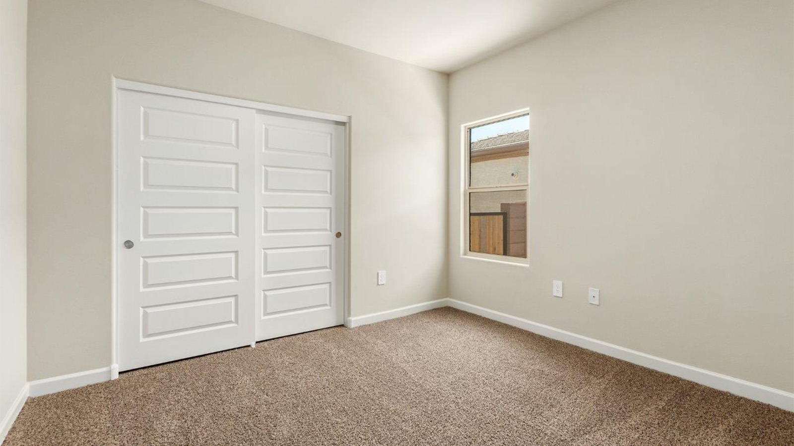 The Lakeway, situated within the beautiful Sycamore Vista community in Vail, Arizona, offers a perfect blend of functionality and comfort, ideal for both growing families and those who appreciate spacious living. With its 2,034 square feet of living space, this single-story new home features five bedrooms and three bathrooms, all meticulously designed to maximize space and convenience.  Entering The Lakeway offers a bright and airy atmosphere that flows through the open-concept floor plan. The heart of the home is the great room, seamlessly connected to the kitchen and dining area. The kitchen is equipped with quartz countertops, Shaker-style cabinetry, and a large island that serves as a focal point for both meal preparation and casual gatherings. The adjoining dining room provides a cozy space for family meals, with easy access to the covered patio through sliding glass doors, creating a wonderful indoor-outdoor living experience.  The primary bedroom is a true retreat, offering a spacious walk-in closet and an en-suite bathroom with a dual-sink vanity and an elegant, tiled shower. The additional bedrooms are thoughtfully spaced to provide ample privacy for family members or guests, and the two secondary bathrooms are finished with modern fixtures and plenty of storage. This home offers a 2-3 car garage option for substantial space of vehicles and storage, accommodating the practical needs of busy households.  Standard features in The Lakeway at Sycamore Vista include energy-efficient elements like a tankless water heater, spray foam insulation, and LED lighting throughout. The home also comes with a Home is Connected® Smart Home package, which includes a smart thermostat, video doorbell, keyless entry, and more, ensuring modern conveniences are at your fingertips. The front yard is beautifully landscaped and includes an auto drip irrigation system, enhancing the curb appeal of this stunning home.  Nestled within Sycamore Vista, The Lakeway combines the tranquility of a rural setting with proximity to excellent schools, shopping, dining, and outdoor recreation, making it an exceptional place to call home.