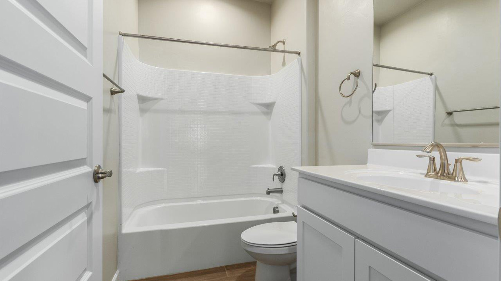 The Lakeway, situated within the beautiful Sycamore Vista community in Vail, Arizona, offers a perfect blend of functionality and comfort, ideal for both growing families and those who appreciate spacious living. With its 2,034 square feet of living space, this single-story new home features five bedrooms and three bathrooms, all meticulously designed to maximize space and convenience.  Entering The Lakeway offers a bright and airy atmosphere that flows through the open-concept floor plan. The heart of the home is the great room, seamlessly connected to the kitchen and dining area. The kitchen is equipped with quartz countertops, Shaker-style cabinetry, and a large island that serves as a focal point for both meal preparation and casual gatherings. The adjoining dining room provides a cozy space for family meals, with easy access to the covered patio through sliding glass doors, creating a wonderful indoor-outdoor living experience.  The primary bedroom is a true retreat, offering a spacious walk-in closet and an en-suite bathroom with a dual-sink vanity and an elegant, tiled shower. The additional bedrooms are thoughtfully spaced to provide ample privacy for family members or guests, and the two secondary bathrooms are finished with modern fixtures and plenty of storage. This home offers a 2-3 car garage option for substantial space of vehicles and storage, accommodating the practical needs of busy households.  Standard features in The Lakeway at Sycamore Vista include energy-efficient elements like a tankless water heater, spray foam insulation, and LED lighting throughout. The home also comes with a Home is Connected® Smart Home package, which includes a smart thermostat, video doorbell, keyless entry, and more, ensuring modern conveniences are at your fingertips. The front yard is beautifully landscaped and includes an auto drip irrigation system, enhancing the curb appeal of this stunning home.  Nestled within Sycamore Vista, The Lakeway combines the tranquility of a rural setting with proximity to excellent schools, shopping, dining, and outdoor recreation, making it an exceptional place to call home.