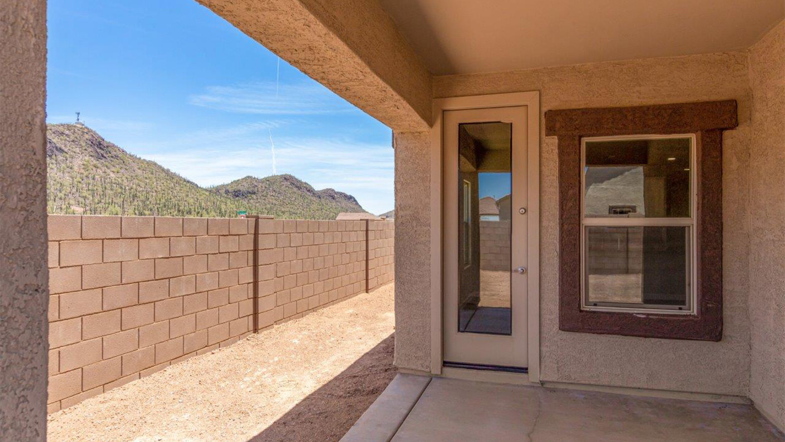 The Lakeway, situated within the beautiful Sycamore Vista community in Vail, Arizona, offers a perfect blend of functionality and comfort, ideal for both growing families and those who appreciate spacious living. With its 2,034 square feet of living space, this single-story new home features five bedrooms and three bathrooms, all meticulously designed to maximize space and convenience.  Entering The Lakeway offers a bright and airy atmosphere that flows through the open-concept floor plan. The heart of the home is the great room, seamlessly connected to the kitchen and dining area. The kitchen is equipped with quartz countertops, Shaker-style cabinetry, and a large island that serves as a focal point for both meal preparation and casual gatherings. The adjoining dining room provides a cozy space for family meals, with easy access to the covered patio through sliding glass doors, creating a wonderful indoor-outdoor living experience.  The primary bedroom is a true retreat, offering a spacious walk-in closet and an en-suite bathroom with a dual-sink vanity and an elegant, tiled shower. The additional bedrooms are thoughtfully spaced to provide ample privacy for family members or guests, and the two secondary bathrooms are finished with modern fixtures and plenty of storage. This home offers a 2-3 car garage option for substantial space of vehicles and storage, accommodating the practical needs of busy households.  Standard features in The Lakeway at Sycamore Vista include energy-efficient elements like a tankless water heater, spray foam insulation, and LED lighting throughout. The home also comes with a Home is Connected® Smart Home package, which includes a smart thermostat, video doorbell, keyless entry, and more, ensuring modern conveniences are at your fingertips. The front yard is beautifully landscaped and includes an auto drip irrigation system, enhancing the curb appeal of this stunning home.  Nestled within Sycamore Vista, The Lakeway combines the tranquility of a rural setting with proximity to excellent schools, shopping, dining, and outdoor recreation, making it an exceptional place to call home.