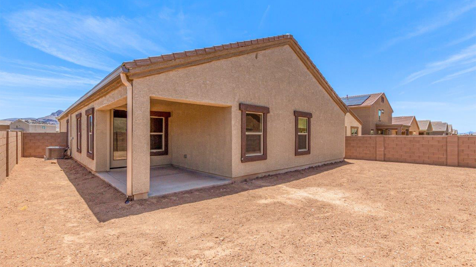 The Lakeway, situated within the beautiful Sycamore Vista community in Vail, Arizona, offers a perfect blend of functionality and comfort, ideal for both growing families and those who appreciate spacious living. With its 2,034 square feet of living space, this single-story new home features five bedrooms and three bathrooms, all meticulously designed to maximize space and convenience.  Entering The Lakeway offers a bright and airy atmosphere that flows through the open-concept floor plan. The heart of the home is the great room, seamlessly connected to the kitchen and dining area. The kitchen is equipped with quartz countertops, Shaker-style cabinetry, and a large island that serves as a focal point for both meal preparation and casual gatherings. The adjoining dining room provides a cozy space for family meals, with easy access to the covered patio through sliding glass doors, creating a wonderful indoor-outdoor living experience.  The primary bedroom is a true retreat, offering a spacious walk-in closet and an en-suite bathroom with a dual-sink vanity and an elegant, tiled shower. The additional bedrooms are thoughtfully spaced to provide ample privacy for family members or guests, and the two secondary bathrooms are finished with modern fixtures and plenty of storage. This home offers a 2-3 car garage option for substantial space of vehicles and storage, accommodating the practical needs of busy households.  Standard features in The Lakeway at Sycamore Vista include energy-efficient elements like a tankless water heater, spray foam insulation, and LED lighting throughout. The home also comes with a Home is Connected® Smart Home package, which includes a smart thermostat, video doorbell, keyless entry, and more, ensuring modern conveniences are at your fingertips. The front yard is beautifully landscaped and includes an auto drip irrigation system, enhancing the curb appeal of this stunning home.  Nestled within Sycamore Vista, The Lakeway combines the tranquility of a rural setting with proximity to excellent schools, shopping, dining, and outdoor recreation, making it an exceptional place to call home.