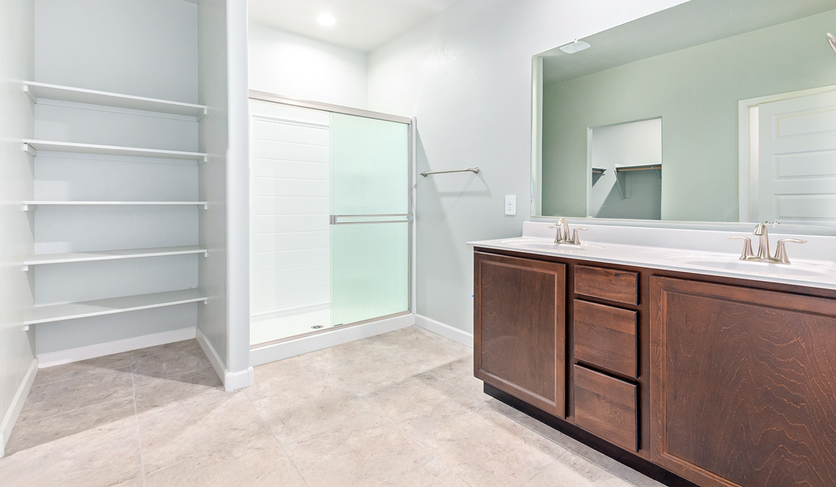 The Lakeway, situated within the beautiful Sycamore Vista community in Vail, Arizona, offers a perfect blend of functionality and comfort, ideal for both growing families and those who appreciate spacious living. With its 2,034 square feet of living space, this single-story new home features five bedrooms and three bathrooms, all meticulously designed to maximize space and convenience.  Entering The Lakeway, you’ll immediately notice the bright and airy atmosphere that flows through the open-concept floor plan. The heart of the home is the great room, seamlessly connected to the kitchen and dining area. The kitchen is equipped with quartz countertops, Shaker-style cabinetry, and a large island that serves as a focal point for both meal preparation and casual gatherings.  The primary bedroom is a true retreat, offering a spacious walk-in closet and an en-suite bathroom. The additional bedrooms are thoughtfully spaced to provide ample privacy for family members or guests, and the two secondary bathrooms are finished with modern fixtures and plenty of storage. This home offers a three-car garage option for substantial space of vehicles and storage, accommodating the practical needs of busy households.  Standard features in The Lakeway at Sycamore Vista include energy-efficient elements like a tankless water heater, spray foam insulation, and LED lighting throughout. The home also comes with a Home is Connected® Smart Home package, which includes a smart thermostat, video doorbell, keyless entry, and more, ensuring modern conveniences are at your fingertips. The front yard is beautifully landscaped and includes an auto drip irrigation system, enhancing the curb appeal of this stunning home.  Nestled within Sycamore Vista, The Lakeway combines the tranquility of a rural setting with proximity to excellent schools, shopping, dining, and outdoor recreation, making it an exceptional place to call home.  *Images shown are for reference only. They depict the model home and may not represent the actual home.