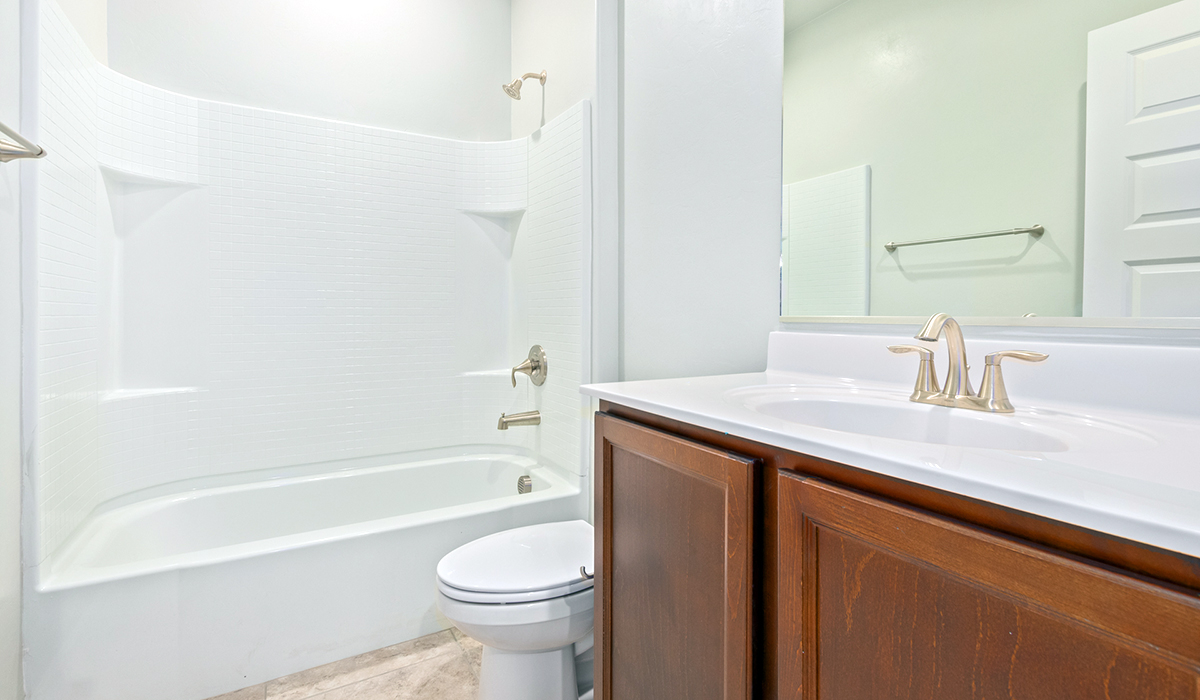 The Lakeway, situated within the beautiful Sycamore Vista community in Vail, Arizona, offers a perfect blend of functionality and comfort, ideal for both growing families and those who appreciate spacious living. With its 2,034 square feet of living space, this single-story new home features five bedrooms and three bathrooms, all meticulously designed to maximize space and convenience.  Entering The Lakeway, you’ll immediately notice the bright and airy atmosphere that flows through the open-concept floor plan. The heart of the home is the great room, seamlessly connected to the kitchen and dining area. The kitchen is equipped with quartz countertops, Shaker-style cabinetry, and a large island that serves as a focal point for both meal preparation and casual gatherings.  The primary bedroom is a true retreat, offering a spacious walk-in closet and an en-suite bathroom. The additional bedrooms are thoughtfully spaced to provide ample privacy for family members or guests, and the two secondary bathrooms are finished with modern fixtures and plenty of storage. This home offers a three-car garage option for substantial space of vehicles and storage, accommodating the practical needs of busy households.  Standard features in The Lakeway at Sycamore Vista include energy-efficient elements like a tankless water heater, spray foam insulation, and LED lighting throughout. The home also comes with a Home is Connected® Smart Home package, which includes a smart thermostat, video doorbell, keyless entry, and more, ensuring modern conveniences are at your fingertips. The front yard is beautifully landscaped and includes an auto drip irrigation system, enhancing the curb appeal of this stunning home.  Nestled within Sycamore Vista, The Lakeway combines the tranquility of a rural setting with proximity to excellent schools, shopping, dining, and outdoor recreation, making it an exceptional place to call home.  *Images shown are for reference only. They depict the model home and may not represent the actual home.