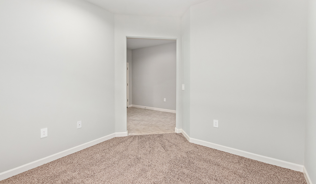 The Lakeway, situated within the beautiful Sycamore Vista community in Vail, Arizona, offers a perfect blend of functionality and comfort, ideal for both growing families and those who appreciate spacious living. With its 2,034 square feet of living space, this single-story new home features five bedrooms and three bathrooms, all meticulously designed to maximize space and convenience.  Entering The Lakeway, you’ll immediately notice the bright and airy atmosphere that flows through the open-concept floor plan. The heart of the home is the great room, seamlessly connected to the kitchen and dining area. The kitchen is equipped with quartz countertops, Shaker-style cabinetry, and a large island that serves as a focal point for both meal preparation and casual gatherings.  The primary bedroom is a true retreat, offering a spacious walk-in closet and an en-suite bathroom. The additional bedrooms are thoughtfully spaced to provide ample privacy for family members or guests, and the two secondary bathrooms are finished with modern fixtures and plenty of storage. This home offers a three-car garage option for substantial space of vehicles and storage, accommodating the practical needs of busy households.  Standard features in The Lakeway at Sycamore Vista include energy-efficient elements like a tankless water heater, spray foam insulation, and LED lighting throughout. The home also comes with a Home is Connected® Smart Home package, which includes a smart thermostat, video doorbell, keyless entry, and more, ensuring modern conveniences are at your fingertips. The front yard is beautifully landscaped and includes an auto drip irrigation system, enhancing the curb appeal of this stunning home.  Nestled within Sycamore Vista, The Lakeway combines the tranquility of a rural setting with proximity to excellent schools, shopping, dining, and outdoor recreation, making it an exceptional place to call home.  *Images shown are for reference only. They depict the model home and may not represent the actual home.