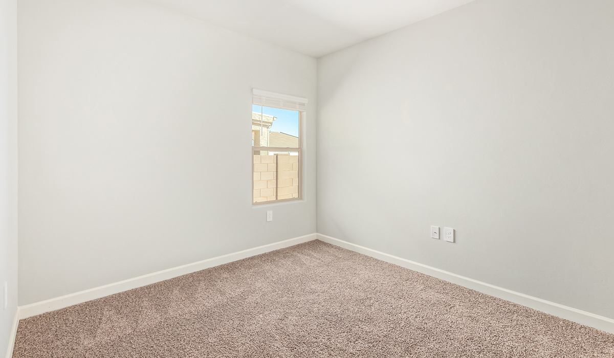 The Lakeway, situated within the beautiful Sycamore Vista community in Vail, Arizona, offers a perfect blend of functionality and comfort, ideal for both growing families and those who appreciate spacious living. With its 2,034 square feet of living space, this single-story new home features five bedrooms and three bathrooms, all meticulously designed to maximize space and convenience.  Entering The Lakeway, you’ll immediately notice the bright and airy atmosphere that flows through the open-concept floor plan. The heart of the home is the great room, seamlessly connected to the kitchen and dining area. The kitchen is equipped with quartz countertops, Shaker-style cabinetry, and a large island that serves as a focal point for both meal preparation and casual gatherings.  The primary bedroom is a true retreat, offering a spacious walk-in closet and an en-suite bathroom. The additional bedrooms are thoughtfully spaced to provide ample privacy for family members or guests, and the two secondary bathrooms are finished with modern fixtures and plenty of storage. This home offers a three-car garage option for substantial space of vehicles and storage, accommodating the practical needs of busy households.  Standard features in The Lakeway at Sycamore Vista include energy-efficient elements like a tankless water heater, spray foam insulation, and LED lighting throughout. The home also comes with a Home is Connected® Smart Home package, which includes a smart thermostat, video doorbell, keyless entry, and more, ensuring modern conveniences are at your fingertips. The front yard is beautifully landscaped and includes an auto drip irrigation system, enhancing the curb appeal of this stunning home.  Nestled within Sycamore Vista, The Lakeway combines the tranquility of a rural setting with proximity to excellent schools, shopping, dining, and outdoor recreation, making it an exceptional place to call home.  *Images shown are for reference only. They depict the model home and may not represent the actual home.