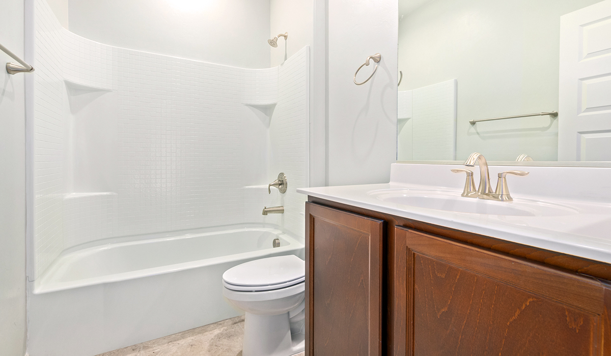 The Lakeway, situated within the beautiful Sycamore Vista community in Vail, Arizona, offers a perfect blend of functionality and comfort, ideal for both growing families and those who appreciate spacious living. With its 2,034 square feet of living space, this single-story new home features five bedrooms and three bathrooms, all meticulously designed to maximize space and convenience.  Entering The Lakeway, you’ll immediately notice the bright and airy atmosphere that flows through the open-concept floor plan. The heart of the home is the great room, seamlessly connected to the kitchen and dining area. The kitchen is equipped with quartz countertops, Shaker-style cabinetry, and a large island that serves as a focal point for both meal preparation and casual gatherings.  The primary bedroom is a true retreat, offering a spacious walk-in closet and an en-suite bathroom. The additional bedrooms are thoughtfully spaced to provide ample privacy for family members or guests, and the two secondary bathrooms are finished with modern fixtures and plenty of storage. This home offers a three-car garage option for substantial space of vehicles and storage, accommodating the practical needs of busy households.  Standard features in The Lakeway at Sycamore Vista include energy-efficient elements like a tankless water heater, spray foam insulation, and LED lighting throughout. The home also comes with a Home is Connected® Smart Home package, which includes a smart thermostat, video doorbell, keyless entry, and more, ensuring modern conveniences are at your fingertips. The front yard is beautifully landscaped and includes an auto drip irrigation system, enhancing the curb appeal of this stunning home.  Nestled within Sycamore Vista, The Lakeway combines the tranquility of a rural setting with proximity to excellent schools, shopping, dining, and outdoor recreation, making it an exceptional place to call home.  *Images shown are for reference only. They depict the model home and may not represent the actual home.