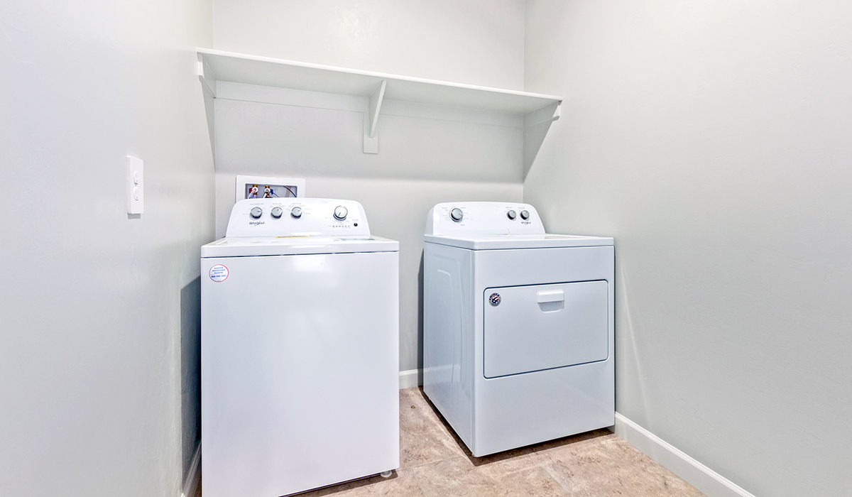 The Lakeway, situated within the beautiful Sycamore Vista community in Vail, Arizona, offers a perfect blend of functionality and comfort, ideal for both growing families and those who appreciate spacious living. With its 2,034 square feet of living space, this single-story new home features five bedrooms and three bathrooms, all meticulously designed to maximize space and convenience.  Entering The Lakeway, you’ll immediately notice the bright and airy atmosphere that flows through the open-concept floor plan. The heart of the home is the great room, seamlessly connected to the kitchen and dining area. The kitchen is equipped with quartz countertops, Shaker-style cabinetry, and a large island that serves as a focal point for both meal preparation and casual gatherings.  The primary bedroom is a true retreat, offering a spacious walk-in closet and an en-suite bathroom. The additional bedrooms are thoughtfully spaced to provide ample privacy for family members or guests, and the two secondary bathrooms are finished with modern fixtures and plenty of storage. This home offers a three-car garage option for substantial space of vehicles and storage, accommodating the practical needs of busy households.  Standard features in The Lakeway at Sycamore Vista include energy-efficient elements like a tankless water heater, spray foam insulation, and LED lighting throughout. The home also comes with a Home is Connected® Smart Home package, which includes a smart thermostat, video doorbell, keyless entry, and more, ensuring modern conveniences are at your fingertips. The front yard is beautifully landscaped and includes an auto drip irrigation system, enhancing the curb appeal of this stunning home.  Nestled within Sycamore Vista, The Lakeway combines the tranquility of a rural setting with proximity to excellent schools, shopping, dining, and outdoor recreation, making it an exceptional place to call home.  *Images shown are for reference only. They depict the model home and may not represent the actual home.