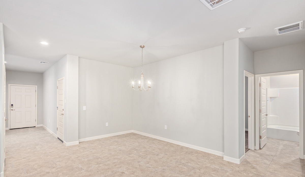 The Lakeway, situated within the beautiful Sycamore Vista community in Vail, Arizona, offers a perfect blend of functionality and comfort, ideal for both growing families and those who appreciate spacious living. With its 2,034 square feet of living space, this single-story new home features five bedrooms and three bathrooms, all meticulously designed to maximize space and convenience.  Entering The Lakeway, you’ll immediately notice the bright and airy atmosphere that flows through the open-concept floor plan. The heart of the home is the great room, seamlessly connected to the kitchen and dining area. The kitchen is equipped with quartz countertops, Shaker-style cabinetry, and a large island that serves as a focal point for both meal preparation and casual gatherings.  The primary bedroom is a true retreat, offering a spacious walk-in closet and an en-suite bathroom. The additional bedrooms are thoughtfully spaced to provide ample privacy for family members or guests, and the two secondary bathrooms are finished with modern fixtures and plenty of storage. This home offers a 2-3 car garage option for substantial space of vehicles and storage, accommodating the practical needs of busy households.  Standard features in The Lakeway at Sycamore Vista include energy-efficient elements like a tankless water heater, spray foam insulation, and LED lighting throughout. The home also comes with a Home is Connected® Smart Home package, which includes a smart thermostat, video doorbell, keyless entry, and more, ensuring modern conveniences are at your fingertips. The front yard is beautifully landscaped and includes an auto drip irrigation system, enhancing the curb appeal of this stunning home.  Nestled within Sycamore Vista, The Lakeway combines the tranquility of a rural setting with proximity to excellent schools, shopping, dining, and outdoor recreation, making it an exceptional place to call home.