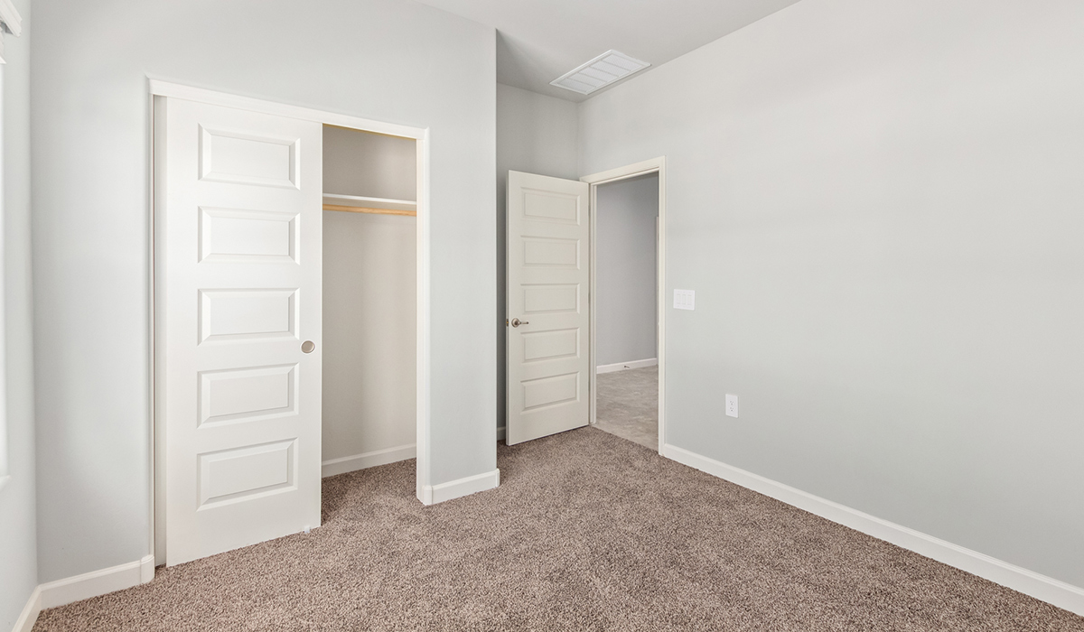 The Lakeway, situated within the beautiful Sycamore Vista community in Vail, Arizona, offers a perfect blend of functionality and comfort, ideal for both growing families and those who appreciate spacious living. With its 2,034 square feet of living space, this single-story new home features five bedrooms and three bathrooms, all meticulously designed to maximize space and convenience.  Entering The Lakeway, you’ll immediately notice the bright and airy atmosphere that flows through the open-concept floor plan. The heart of the home is the great room, seamlessly connected to the kitchen and dining area. The kitchen is equipped with quartz countertops, Shaker-style cabinetry, and a large island that serves as a focal point for both meal preparation and casual gatherings.  The primary bedroom is a true retreat, offering a spacious walk-in closet and an en-suite bathroom. The additional bedrooms are thoughtfully spaced to provide ample privacy for family members or guests, and the two secondary bathrooms are finished with modern fixtures and plenty of storage. This home offers a 2-3 car garage option for substantial space of vehicles and storage, accommodating the practical needs of busy households.  Standard features in The Lakeway at Sycamore Vista include energy-efficient elements like a tankless water heater, spray foam insulation, and LED lighting throughout. The home also comes with a Home is Connected® Smart Home package, which includes a smart thermostat, video doorbell, keyless entry, and more, ensuring modern conveniences are at your fingertips. The front yard is beautifully landscaped and includes an auto drip irrigation system, enhancing the curb appeal of this stunning home.  Nestled within Sycamore Vista, The Lakeway combines the tranquility of a rural setting with proximity to excellent schools, shopping, dining, and outdoor recreation, making it an exceptional place to call home.