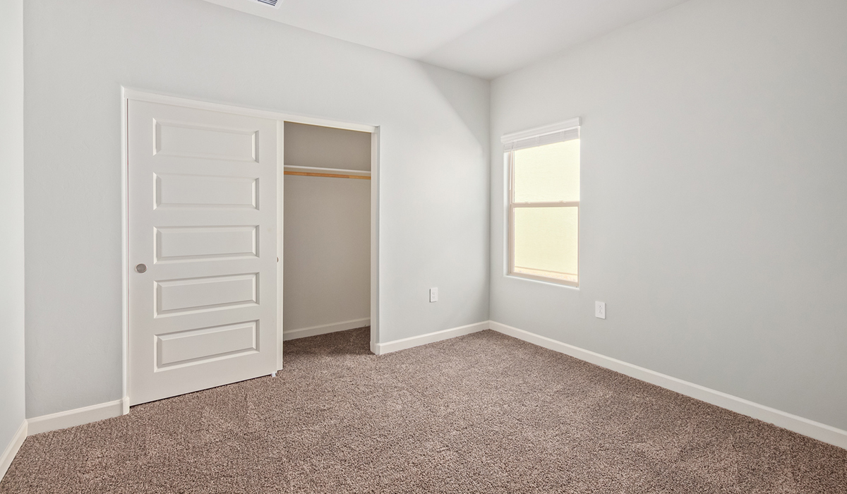 The Lakeway, situated within the beautiful Sycamore Vista community in Vail, Arizona, offers a perfect blend of functionality and comfort, ideal for both growing families and those who appreciate spacious living. With its 2,034 square feet of living space, this single-story new home features five bedrooms and three bathrooms, all meticulously designed to maximize space and convenience.  Entering The Lakeway, you’ll immediately notice the bright and airy atmosphere that flows through the open-concept floor plan. The heart of the home is the great room, seamlessly connected to the kitchen and dining area. The kitchen is equipped with quartz countertops, Shaker-style cabinetry, and a large island that serves as a focal point for both meal preparation and casual gatherings.  The primary bedroom is a true retreat, offering a spacious walk-in closet and an en-suite bathroom. The additional bedrooms are thoughtfully spaced to provide ample privacy for family members or guests, and the two secondary bathrooms are finished with modern fixtures and plenty of storage. This home offers a 2-3 car garage option for substantial space of vehicles and storage, accommodating the practical needs of busy households.  Standard features in The Lakeway at Sycamore Vista include energy-efficient elements like a tankless water heater, spray foam insulation, and LED lighting throughout. The home also comes with a Home is Connected® Smart Home package, which includes a smart thermostat, video doorbell, keyless entry, and more, ensuring modern conveniences are at your fingertips. The front yard is beautifully landscaped and includes an auto drip irrigation system, enhancing the curb appeal of this stunning home.  Nestled within Sycamore Vista, The Lakeway combines the tranquility of a rural setting with proximity to excellent schools, shopping, dining, and outdoor recreation, making it an exceptional place to call home.