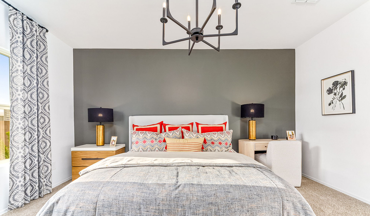 The Cali is a standout single-story new home floorplan available in the Saguaro Bloom community in Marana, Arizona. Offering 1,823 square feet of living space, this home is designed to accommodate modern living with comfort and style. The Cali provides a flexible layout with four bedrooms and two bathrooms, making it an ideal choice for families of all sizes.  The exterior of the Cali presents an inviting façade with its beautiful exterior finishes to suit diverse tastes. As you step inside, you'll be welcomed by a spacious great room that seamlessly connects to the kitchen and dining areas, making it perfect for gatherings and day-to-day living.  This home is equipped with a range of standard features that enhance both its functionality and appeal. Enjoy energy-efficient LED lighting throughout, and a programmable thermostat for easy climate control. The home also includes high-quality finishes such as quartz countertops in the kitchen and bathrooms, and durable wood-look tile flooring in the main living areas.  The kitchen, a focal point of the home, is equipped with stainless steel appliances, ample counter space, and a walk-in pantry that enhances both function and style. The primary bedroom, located at the rear of the home, offers privacy and includes a large walk-in closet and a modern ensuite bathroom with dual vanities and a spacious shower. The remaining three bedrooms are well-sized and share a conveniently located bathroom.  Designed with practicality in mind, this floorplan includes a two-car garage with an option for a third, a utility room with washer and dryer connections, and additional storage space.   Living in Agave at Saguaro Bloom provides residents with access to top-rated schools, community parks, and scenic walking trails. This vibrant neighborhood is the perfect setting for those looking to enjoy the best of Arizona living.  *Images shown are for reference only. They depict the sales model home and may not represent the actual home.