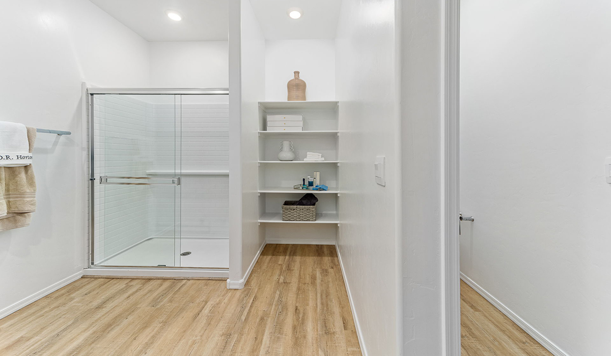 Welcome to the Kingston floor plan in the Agave neighborhood at Saguaro Bloom, Marana, Arizona—a perfect blend of comfort, modern living, and energy efficiency. This thoughtfully crafted one-story home spans 2,051 square feet and offers four bedrooms and two bathrooms, ideal for families of all sizes.  The open-concept design features a spacious great room that effortlessly connects with the kitchen and dining area, creating an inviting central hub for everyday living and entertaining. The kitchen is equipped with contemporary appliances and a pantry.  The primary bedroom, located at the rear of the home, provides a peaceful retreat with a private ensuite bathroom and a walk-in closet. The additional three bedrooms are positioned at the front of the house, offering versatility for use as guest rooms, a home office, or children’s bedrooms. Step outside to the covered patio, a perfect spot to enjoy the beautiful Arizona weather.  Built with energy efficiency as a priority, the Kingston includes smart home technology, which not only simplifies daily living but also helps reduce utility costs. A two-car garage provides ample parking and additional storage space, enhancing the home’s functionality.  Residents of Saguaro Bloom enjoy access to a range of community amenities, including parks, walking trails, and recreational facilities, making this home an ideal choice for those seeking a balanced lifestyle in a scenic setting.  *Images shown are for reference only. They depict The Kingston sales model home and may not represent the actual home.