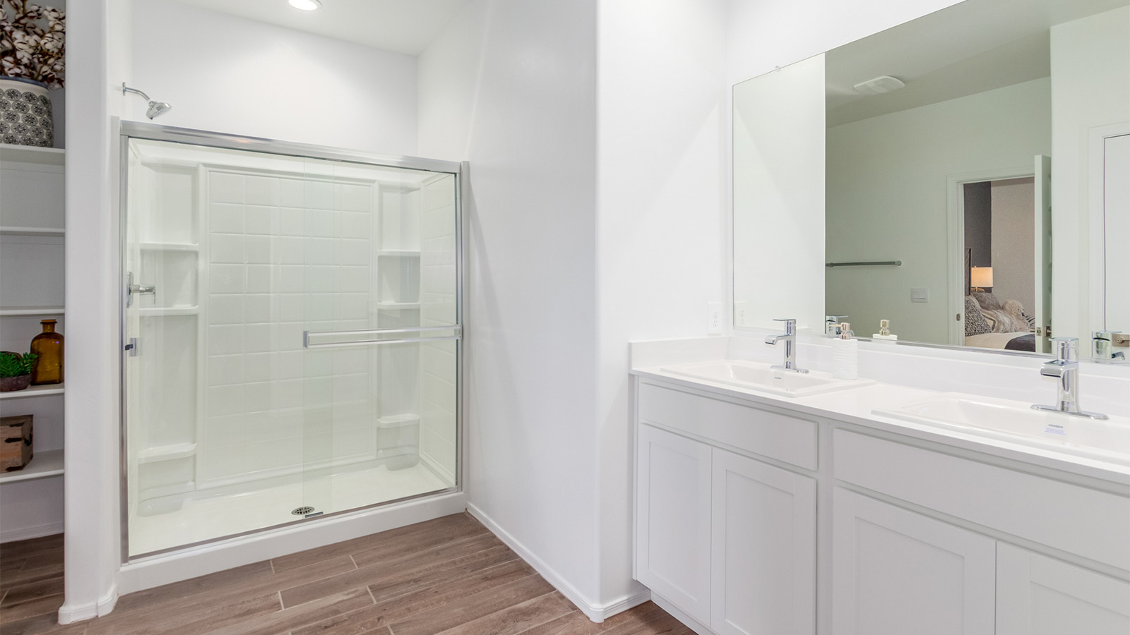 The Cali is a standout single-story new home floorplan available in the Saguaro Bloom community in Marana, Arizona. Offering 1,823 square feet of living space, this home is designed to accommodate modern living with comfort and style. The Cali provides a flexible layout with four bedrooms and two bathrooms, making it an ideal choice for families of all sizes.  The exterior of the Cali presents an inviting façade with its beautiful exterior finishes to suit diverse tastes. As you step inside, you'll be welcomed by a spacious great room that seamlessly connects to the kitchen and dining areas, making it perfect for gatherings and day-to-day living.  This home is equipped with a range of standard features that enhance both its functionality and appeal. Enjoy energy-efficient LED lighting throughout, and a programmable thermostat for easy climate control. The home also includes high-quality finishes such as quartz countertops in the kitchen and bathrooms, and durable wood-look tile flooring in the main living areas.  The kitchen, a focal point of the home, is equipped with stainless steel appliances, ample counter space, and a walk-in pantry that enhances both function and style. The primary bedroom, located at the rear of the home, offers privacy and includes a large walk-in closet and a modern ensuite bathroom with dual vanities and a spacious shower. The remaining three bedrooms are well-sized and share a conveniently located bathroom.  Designed with practicality in mind, this floorplan includes a two-car garage with an option for a third, a utility room with washer and dryer connections, and additional storage space.   Living in Agave at Saguaro Bloom provides residents with access to top-rated schools, community parks, and scenic walking trails. This vibrant neighborhood is the perfect setting for those looking to enjoy the best of Arizona living.  *Images shown are for reference only. They depict the sales model home and may not represent the actual home.