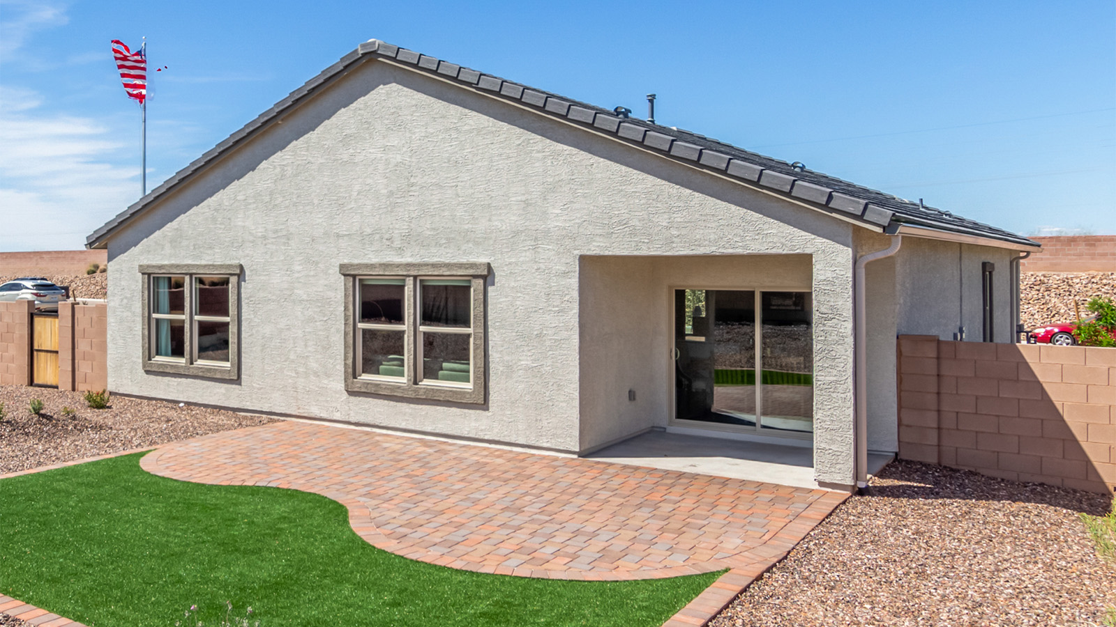 The Cali is a standout single-story new home floorplan available in the Saguaro Bloom community in Marana, Arizona. Offering 1,823 square feet of living space, this home is designed to accommodate modern living with comfort and style. The Cali provides a flexible layout with four bedrooms and two bathrooms, making it an ideal choice for families of all sizes.  The exterior of the Cali presents an inviting façade with its beautiful exterior finishes to suit diverse tastes. As you step inside, you'll be welcomed by a spacious great room that seamlessly connects to the kitchen and dining areas, making it perfect for gatherings and day-to-day living.  This home is equipped with a range of standard features that enhance both its functionality and appeal. Enjoy energy-efficient LED lighting throughout, and a programmable thermostat for easy climate control. The home also includes high-quality finishes such as quartz countertops in the kitchen and bathrooms, and durable wood-look tile flooring in the main living areas.  The kitchen, a focal point of the home, is equipped with stainless steel appliances, ample counter space, and a walk-in pantry that enhances both function and style. The primary bedroom, located at the rear of the home, offers privacy and includes a large walk-in closet and a modern ensuite bathroom with dual vanities and a spacious shower. The remaining three bedrooms are well-sized and share a conveniently located bathroom.  Designed with practicality in mind, this floorplan includes a two-car garage with an option for a third, a utility room with washer and dryer connections, and additional storage space.   Living in Agave at Saguaro Bloom provides residents with access to top-rated schools, community parks, and scenic walking trails. This vibrant neighborhood is the perfect setting for those looking to enjoy the best of Arizona living.  *Images shown are for reference only. They depict the sales model home and may not represent the actual home.