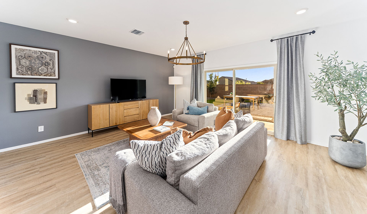 Welcome to the Kingston floor plan at Saguaro Bloom, Marana, Arizona, a perfect blend of comfort, modern living, and energy efficiency. This thoughtfully crafted one-story home spans 2,051 square feet and offers four bedrooms and two bathrooms, ideal for families of all sizes.  The open-concept design features a spacious great room that effortlessly connects with the kitchen and dining area, creating an inviting central hub for everyday living and entertaining. The kitchen is equipped with contemporary appliances and a pantry.  The primary bedroom, located at the rear of the home, provides a peaceful retreat with a private ensuite bathroom and a walk-in closet. The additional three bedrooms are positioned at the front of the house, offering versatility for use as guest rooms, a home office, or children’s bedrooms. Step outside to the covered patio, a perfect spot to enjoy the beautiful Arizona weather.  Built with energy efficiency as a priority, the Kingston includes smart home technology, which not only simplifies daily living but also helps reduce utility costs. A two-car garage provides ample parking and additional storage space, enhancing the home’s functionality.  Residents of Saguaro Bloom enjoy access to a range of community amenities, including parks, walking trails, and recreational facilities, making this home an ideal choice for those seeking a balanced lifestyle in a scenic setting.  *Images shown are for reference only. They depict The Kingston sales model home and may not represent the actual home.