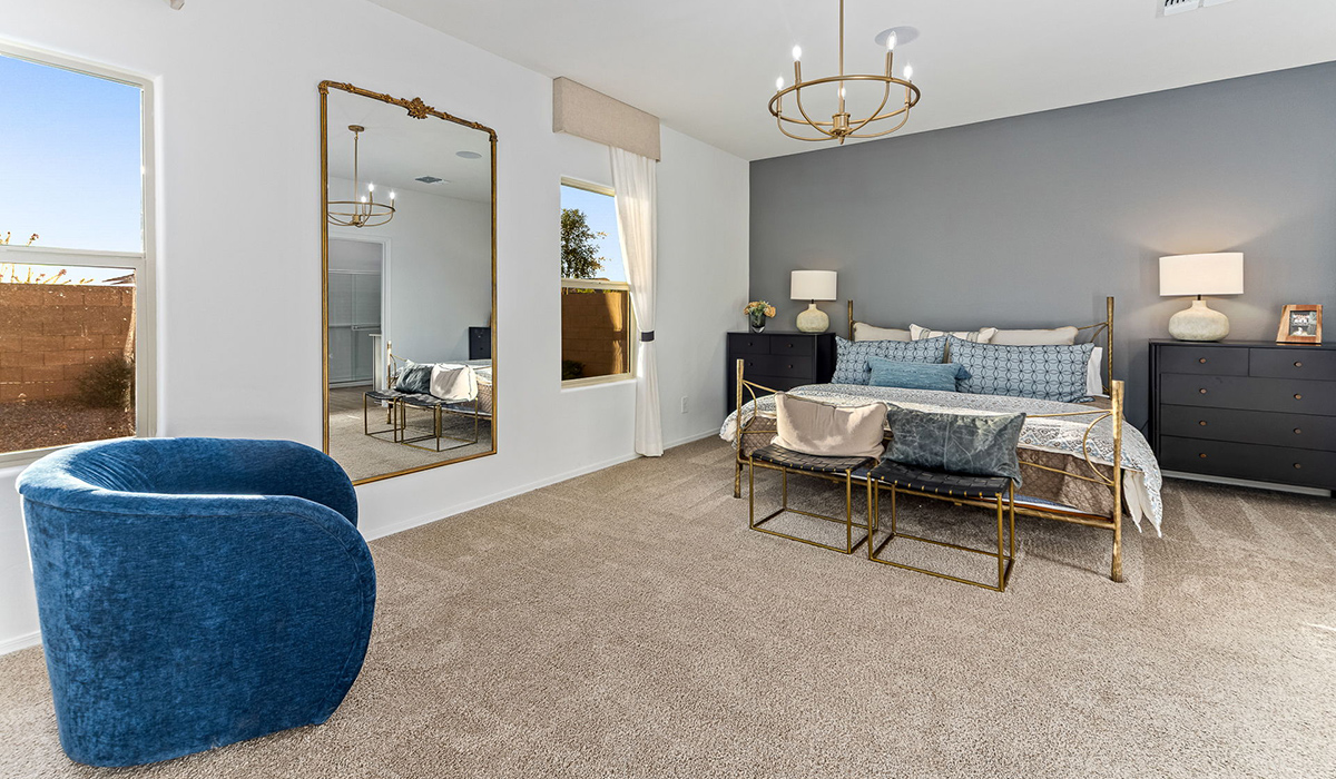 Welcome to the Kingston floor plan at Saguaro Bloom, Marana, Arizona, a perfect blend of comfort, modern living, and energy efficiency. This thoughtfully crafted one-story home spans 2,051 square feet and offers four bedrooms and two bathrooms, ideal for families of all sizes.  The open-concept design features a spacious great room that effortlessly connects with the kitchen and dining area, creating an inviting central hub for everyday living and entertaining. The kitchen is equipped with contemporary appliances and a pantry.  The primary bedroom, located at the rear of the home, provides a peaceful retreat with a private ensuite bathroom and a walk-in closet. The additional three bedrooms are positioned at the front of the house, offering versatility for use as guest rooms, a home office, or children’s bedrooms. Step outside to the covered patio, a perfect spot to enjoy the beautiful Arizona weather.  Built with energy efficiency as a priority, the Kingston includes smart home technology, which not only simplifies daily living but also helps reduce utility costs. A two-car garage provides ample parking and additional storage space, enhancing the home’s functionality.  Residents of Saguaro Bloom enjoy access to a range of community amenities, including parks, walking trails, and recreational facilities, making this home an ideal choice for those seeking a balanced lifestyle in a scenic setting.  *Images shown are for reference only. They depict The Kingston sales model home and may not represent the actual home.