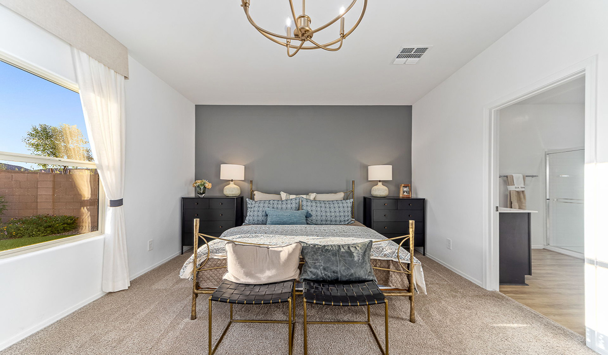Welcome to the Kingston floor plan at Saguaro Bloom, Marana, Arizona, a perfect blend of comfort, modern living, and energy efficiency. This thoughtfully crafted one-story home spans 2,051 square feet and offers four bedrooms and two bathrooms, ideal for families of all sizes.  The open-concept design features a spacious great room that effortlessly connects with the kitchen and dining area, creating an inviting central hub for everyday living and entertaining. The kitchen is equipped with contemporary appliances and a pantry.  The primary bedroom, located at the rear of the home, provides a peaceful retreat with a private ensuite bathroom and a walk-in closet. The additional three bedrooms are positioned at the front of the house, offering versatility for use as guest rooms, a home office, or children’s bedrooms. Step outside to the covered patio, a perfect spot to enjoy the beautiful Arizona weather.  Built with energy efficiency as a priority, the Kingston includes smart home technology, which not only simplifies daily living but also helps reduce utility costs. A two-car garage provides ample parking and additional storage space, enhancing the home’s functionality.  Residents of Saguaro Bloom enjoy access to a range of community amenities, including parks, walking trails, and recreational facilities, making this home an ideal choice for those seeking a balanced lifestyle in a scenic setting.  *Images shown are for reference only. They depict The Kingston sales model home and may not represent the actual home.
