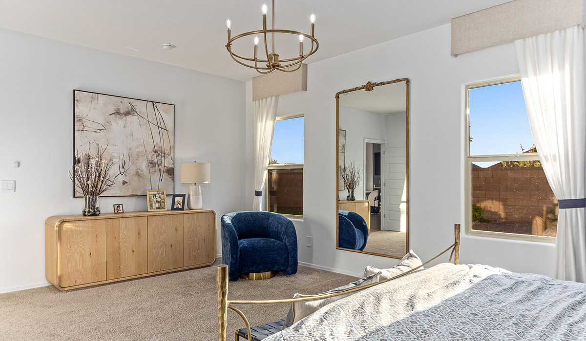 Welcome to the Kingston floor plan at Saguaro Bloom, Marana, Arizona, a perfect blend of comfort, modern living, and energy efficiency. This thoughtfully crafted one-story home spans 2,051 square feet and offers four bedrooms and two bathrooms, ideal for families of all sizes.  The open-concept design features a spacious great room that effortlessly connects with the kitchen and dining area, creating an inviting central hub for everyday living and entertaining. The kitchen is equipped with contemporary appliances and a pantry.  The primary bedroom, located at the rear of the home, provides a peaceful retreat with a private ensuite bathroom and a walk-in closet. The additional three bedrooms are positioned at the front of the house, offering versatility for use as guest rooms, a home office, or children’s bedrooms. Step outside to the covered patio, a perfect spot to enjoy the beautiful Arizona weather.  Built with energy efficiency as a priority, the Kingston includes smart home technology, which not only simplifies daily living but also helps reduce utility costs. A two-car garage provides ample parking and additional storage space, enhancing the home’s functionality.  Residents of Saguaro Bloom enjoy access to a range of community amenities, including parks, walking trails, and recreational facilities, making this home an ideal choice for those seeking a balanced lifestyle in a scenic setting.  *Images shown are for reference only. They depict The Kingston sales model home and may not represent the actual home.