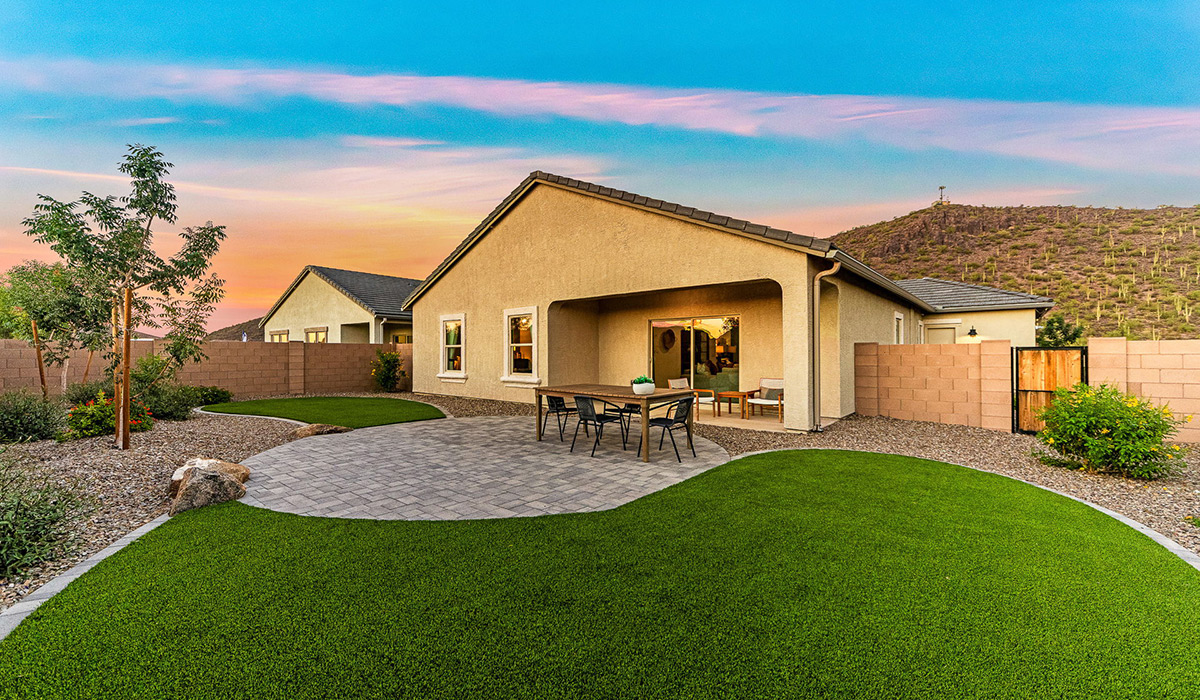 Welcome to the Kingston floor plan at Saguaro Bloom, Marana, Arizona, a perfect blend of comfort, modern living, and energy efficiency. This thoughtfully crafted one-story home spans 2,051 square feet and offers four bedrooms and two bathrooms, ideal for families of all sizes.  The open-concept design features a spacious great room that effortlessly connects with the kitchen and dining area, creating an inviting central hub for everyday living and entertaining. The kitchen is equipped with contemporary appliances and a pantry.  The primary bedroom, located at the rear of the home, provides a peaceful retreat with a private ensuite bathroom and a walk-in closet. The additional three bedrooms are positioned at the front of the house, offering versatility for use as guest rooms, a home office, or children’s bedrooms. Step outside to the covered patio, a perfect spot to enjoy the beautiful Arizona weather.  Built with energy efficiency as a priority, the Kingston includes smart home technology, which not only simplifies daily living but also helps reduce utility costs. A two-car garage provides ample parking and additional storage space, enhancing the home’s functionality.  Residents of Saguaro Bloom enjoy access to a range of community amenities, including parks, walking trails, and recreational facilities, making this home an ideal choice for those seeking a balanced lifestyle in a scenic setting.  *Images shown are for reference only. They depict The Kingston sales model home and may not represent the actual home.