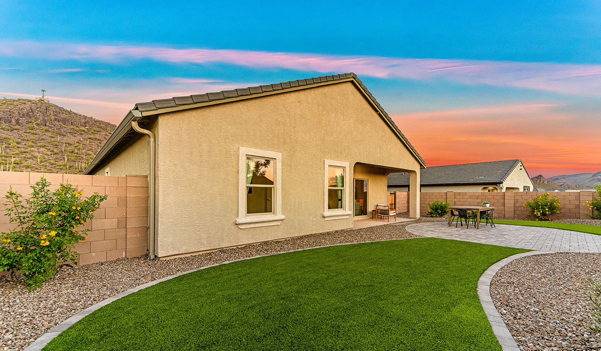 Welcome to the Kingston floor plan at Saguaro Bloom, Marana, Arizona, a perfect blend of comfort, modern living, and energy efficiency. This thoughtfully crafted one-story home spans 2,051 square feet and offers four bedrooms and two bathrooms, ideal for families of all sizes.  The open-concept design features a spacious great room that effortlessly connects with the kitchen and dining area, creating an inviting central hub for everyday living and entertaining. The kitchen is equipped with contemporary appliances and a pantry.  The primary bedroom, located at the rear of the home, provides a peaceful retreat with a private ensuite bathroom and a walk-in closet. The additional three bedrooms are positioned at the front of the house, offering versatility for use as guest rooms, a home office, or children’s bedrooms. Step outside to the covered patio, a perfect spot to enjoy the beautiful Arizona weather.  Built with energy efficiency as a priority, the Kingston includes smart home technology, which not only simplifies daily living but also helps reduce utility costs. A two-car garage provides ample parking and additional storage space, enhancing the home’s functionality.  Residents of Saguaro Bloom enjoy access to a range of community amenities, including parks, walking trails, and recreational facilities, making this home an ideal choice for those seeking a balanced lifestyle in a scenic setting.  *Images shown are for reference only. They depict The Kingston sales model home and may not represent the actual home.