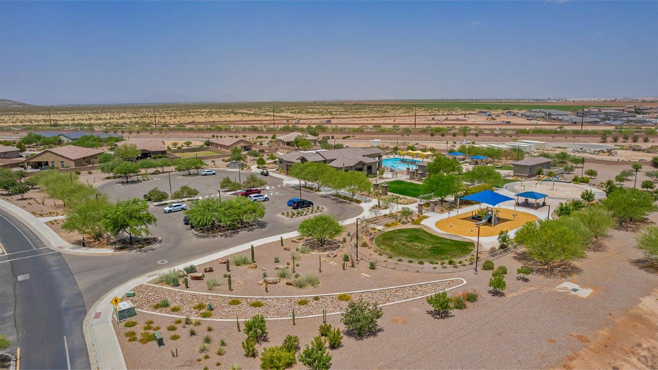 Welcome to The Amber, a thoughtfully designed single-story new home nestled in the Mesquite neighborhood at Saguaro Bloom, a master-planned community in Marana, Arizona. With 1,331 square feet of efficient living space, The Amber is perfect for those seeking a cozy yet functional home environment.  Enter into a welcoming entryway that immediately introduces you to the home’s smart layout. The open design maximizes every square foot, with the heart of the home being the expansive great room, which flows seamlessly into the dining area and kitchen. The kitchen is well-equipped with a central island, quartz countertops, and Shaker-style cabinets, offering a clean and modern aesthetic. A dedicated walk-in pantry adds extra storage, ensuring that all your culinary essentials are within reach.  The Amber offers three comfortable bedrooms. The primary suite is situated at the rear of the home, providing a sense of privacy. It includes a walk-in closet and an en-suite bathroom. The two additional bedrooms are thoughtfully placed near the front of the home, sharing access to a full bathroom, making this layout perfect for families, guests, or a home office.  Practicality meets comfort in this home, with a utility room conveniently located near the kitchen and garage, providing easy access to the laundry area and additional storage. The Amber also includes a covered patio that extends the living space outdoors, ideal for enjoying Arizona’s beautiful weather.  The Amber is not just a home; it’s a lifestyle. Located in the vibrant Saguaro Bloom community, residents enjoy access to a wide range of amenities, from swimming pools and parks to miles of scenic walking trails. Whether you’re a first-time homebuyer or looking to downsize, The Amber offers a perfect blend of comfort, style, and convenience in one of Marana’s most desirable neighborhoods.