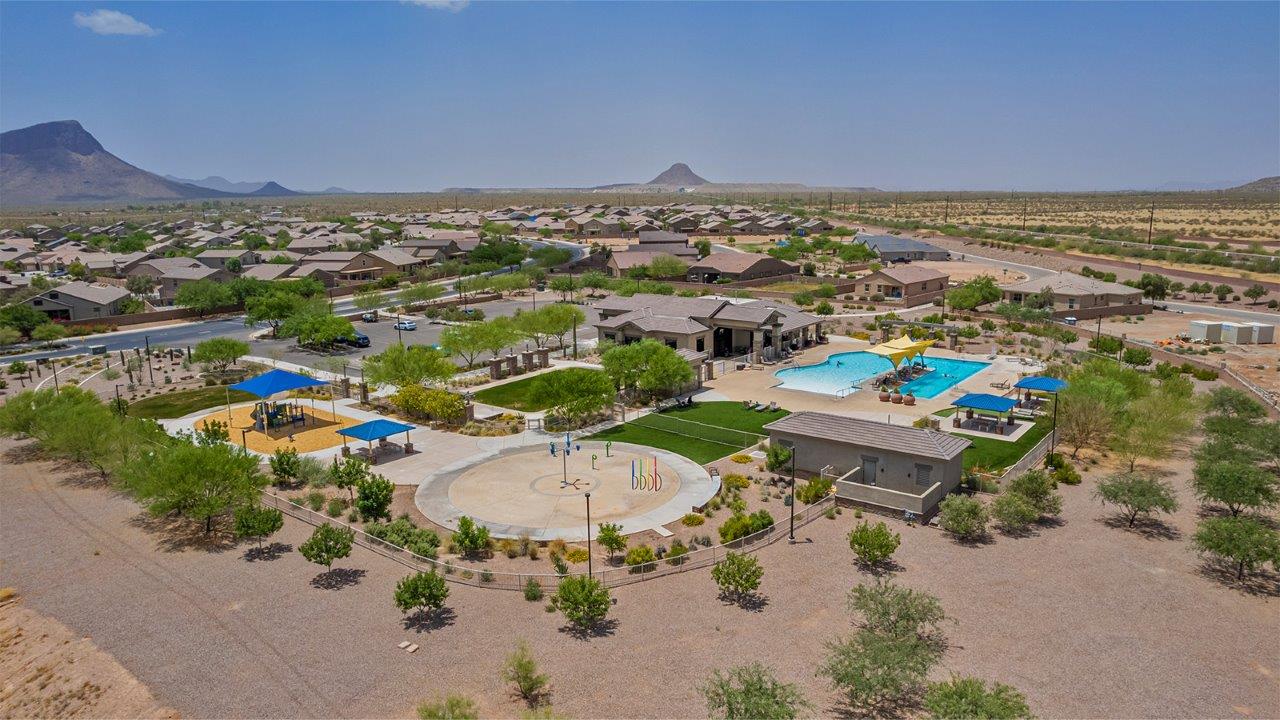 Welcome to The Amber, a thoughtfully designed single-story new home nestled in the Mesquite neighborhood at Saguaro Bloom, a master-planned community in Marana, Arizona. With 1,331 square feet of efficient living space, The Amber is perfect for those seeking a cozy yet functional home environment.  Enter into a welcoming entryway that immediately introduces you to the home’s smart layout. The open design maximizes every square foot, with the heart of the home being the expansive great room, which flows seamlessly into the dining area and kitchen. The kitchen is well-equipped with a central island, quartz countertops, and Shaker-style cabinets, offering a clean and modern aesthetic. A dedicated walk-in pantry adds extra storage, ensuring that all your culinary essentials are within reach.  The Amber offers three comfortable bedrooms. The primary suite is situated at the rear of the home, providing a sense of privacy. It includes a walk-in closet and an en-suite bathroom. The two additional bedrooms are thoughtfully placed near the front of the home, sharing access to a full bathroom, making this layout perfect for families, guests, or a home office.  Practicality meets comfort in this home, with a utility room conveniently located near the kitchen and garage, providing easy access to the laundry area and additional storage. The Amber also includes a covered patio that extends the living space outdoors, ideal for enjoying Arizona’s beautiful weather.  The Amber is not just a home; it’s a lifestyle. Located in the vibrant Saguaro Bloom community, residents enjoy access to a wide range of amenities, from swimming pools and parks to miles of scenic walking trails. Whether you’re a first-time homebuyer or looking to downsize, The Amber offers a perfect blend of comfort, style, and convenience in one of Marana’s most desirable neighborhoods.