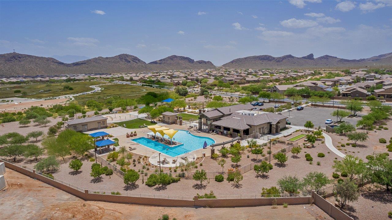 Welcome to The Amber, a thoughtfully designed single-story new home nestled in the Mesquite neighborhood at Saguaro Bloom, a master-planned community in Marana, Arizona. With 1,331 square feet of efficient living space, The Amber is perfect for those seeking a cozy yet functional home environment.  Enter into a welcoming entryway that immediately introduces you to the home’s smart layout. The open design maximizes every square foot, with the heart of the home being the expansive great room, which flows seamlessly into the dining area and kitchen. The kitchen is well-equipped with a central island, quartz countertops, and Shaker-style cabinets, offering a clean and modern aesthetic. A dedicated walk-in pantry adds extra storage, ensuring that all your culinary essentials are within reach.  The Amber offers three comfortable bedrooms. The primary suite is situated at the rear of the home, providing a sense of privacy. It includes a walk-in closet and an en-suite bathroom. The two additional bedrooms are thoughtfully placed near the front of the home, sharing access to a full bathroom, making this layout perfect for families, guests, or a home office.  Practicality meets comfort in this home, with a utility room conveniently located near the kitchen and garage, providing easy access to the laundry area and additional storage. The Amber also includes a covered patio that extends the living space outdoors, ideal for enjoying Arizona’s beautiful weather.  The Amber is not just a home; it’s a lifestyle. Located in the vibrant Saguaro Bloom community, residents enjoy access to a wide range of amenities, from swimming pools and parks to miles of scenic walking trails. Whether you’re a first-time homebuyer or looking to downsize, The Amber offers a perfect blend of comfort, style, and convenience in one of Marana’s most desirable neighborhoods.