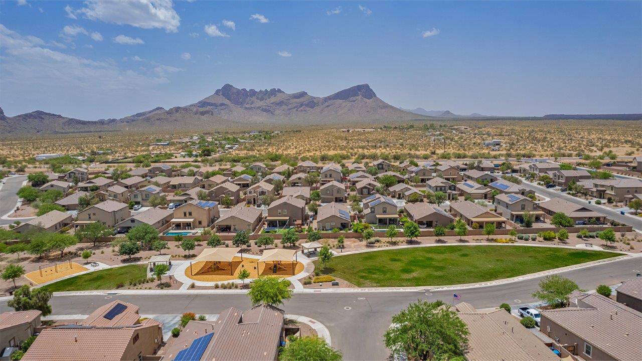 Welcome to The Amber, a thoughtfully designed single-story new home nestled in the Mesquite neighborhood at Saguaro Bloom, a master-planned community in Marana, Arizona. With 1,331 square feet of efficient living space, The Amber is perfect for those seeking a cozy yet functional home environment.  Enter into a welcoming entryway that immediately introduces you to the home’s smart layout. The open design maximizes every square foot, with the heart of the home being the expansive great room, which flows seamlessly into the dining area and kitchen. The kitchen is well-equipped with a central island, quartz countertops, and Shaker-style cabinets, offering a clean and modern aesthetic. A dedicated walk-in pantry adds extra storage, ensuring that all your culinary essentials are within reach.  The Amber offers three comfortable bedrooms. The primary suite is situated at the rear of the home, providing a sense of privacy. It includes a walk-in closet and an en-suite bathroom. The two additional bedrooms are thoughtfully placed near the front of the home, sharing access to a full bathroom, making this layout perfect for families, guests, or a home office.  Practicality meets comfort in this home, with a utility room conveniently located near the kitchen and garage, providing easy access to the laundry area and additional storage. The Amber also includes a covered patio that extends the living space outdoors, ideal for enjoying Arizona’s beautiful weather.  The Amber is not just a home; it’s a lifestyle. Located in the vibrant Saguaro Bloom community, residents enjoy access to a wide range of amenities, from swimming pools and parks to miles of scenic walking trails. Whether you’re a first-time homebuyer or looking to downsize, The Amber offers a perfect blend of comfort, style, and convenience in one of Marana’s most desirable neighborhoods.