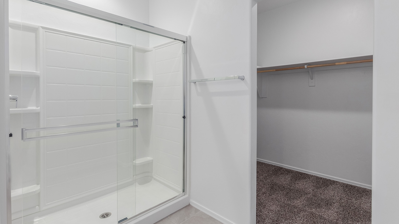 Welcome to The Diana, a beautifully designed single-story new home located in the Mesquite neighborhood at Saguaro Bloom, one of Marana’s premier master-planned communities. Spanning 1,558 square feet, The Diana offers an ideal balance of comfort and style, perfectly suited for modern living.  As you step inside, you are welcomed by an inviting entryway that leads into the heart of the home. The open layout is designed for convenience, with a spacious great room that seamlessly integrates with the dining area and kitchen, creating a central space perfect for everyday life and entertaining. The kitchen is a true centerpiece, featuring an island, quartz countertops, and stylish Shaker-style cabinetry, all working together to create a space that is practical and elegant.  The Diana offers three bedrooms and provides ample room for everyone in the household. The primary bedroom is thoughtfully positioned for privacy and comes with a walk-in closet and a private en-suite bathroom, offering a personal retreat at the end of the day. The two additional bedrooms are located near the front of the home, sharing a full bathroom, making this layout ideal for families or for extra guest space.  With a dedicated utility room conveniently situated near the entry and a spacious pantry just off the kitchen, The Diana is designed to meet the needs of today’s busy lifestyles. Large windows throughout the home allow natural light to fill the space, creating a bright and welcoming atmosphere.  Step outside to the covered patio, perfect for enjoying the Arizona climate. Whether you're hosting a summer barbecue or simply unwinding in the evening, this outdoor space is a valuable addition to the home.  Situated in the desirable Saguaro Bloom community, residents will enjoy access to a wide range of amenities, including community pools, walking trails, and parks, all surrounded by the natural beauty of the Tucson Mountains.