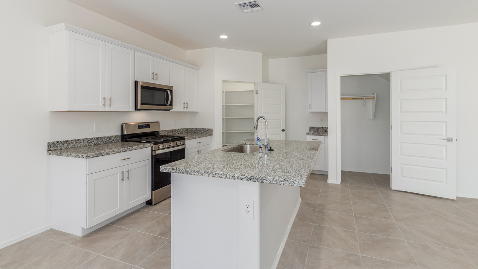 Welcome to The Grace, an intentionally designed two-story new home nestled in the Mesquite neighborhood at Saguaro Bloom, one of Marana’s most desirable communities. Offering 1,963 square feet of living space, The Grace is perfect for those who value both comfort and modern design.  As you enter through the front porch, a welcoming foyer leads you into the open-concept main floor, where the great room, dining area, and kitchen are seamlessly connected. The kitchen is a chef’s delight, featuring a central island, granite countertops, and elegant Shaker-style cabinetry available in either white or gray. The layout is designed to maximize both function and style, ensuring that whether you're preparing a meal or hosting guests, the space works for you.  Upstairs, The Grace features four spacious bedrooms, each offering privacy and ample room for relaxation. The primary suite is a highlight, offering a private retreat with a walk-in closet and an en-suite bathroom equipped with dual vanities and a spacious shower. The additional bedrooms share a luxurious bathroom, and the convenient upstairs utility room makes laundry day a breeze.  The Grace also includes a covered patio, extending your living space outdoors, perfect for enjoying the beautiful Arizona evenings. The practical design continues with a dedicated powder room on the main level, making it convenient for guests.  This home is designed with today’s homeowner in mind, incorporating smart home technology and energy-efficient features that ensure a modern lifestyle while keeping energy costs down. Large windows allow natural light to fill the space, creating a bright and airy atmosphere throughout.  Located in the vibrant Saguaro Bloom community, The Grace offers residents access to a wealth of amenities, including community pools, walking trails, and more, all set against the stunning backdrop of the Tucson Mountains. The Grace is not just a home; it's an opportunity to live in comfort and style while enjoying everything this exceptional community has to offer.