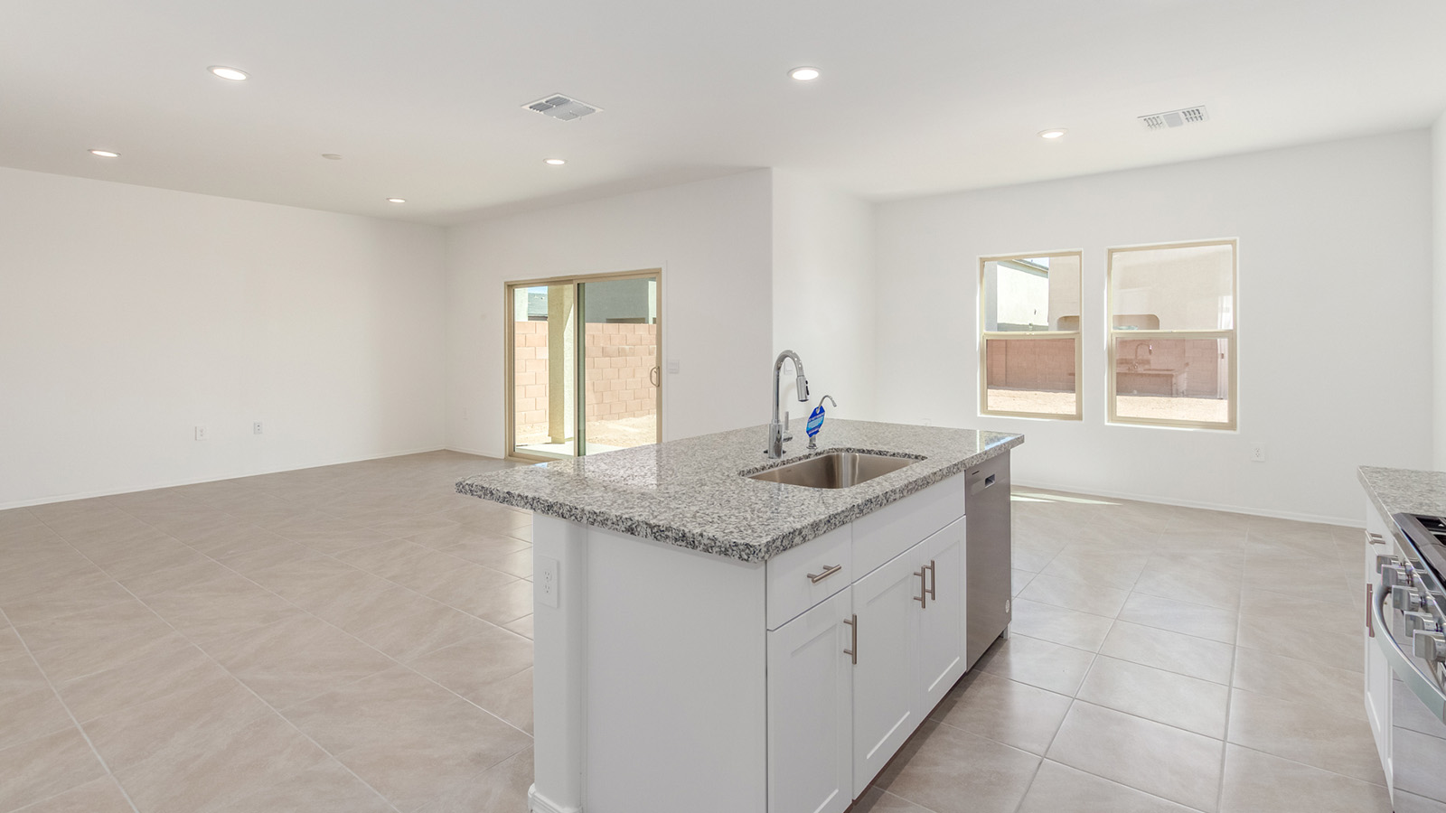 Welcome to The Grace, an intentionally designed two-story new home nestled in the Mesquite neighborhood at Saguaro Bloom, one of Marana’s most desirable communities. Offering 1,963 square feet of living space, The Grace is perfect for those who value both comfort and modern design.  As you enter through the front porch, a welcoming foyer leads you into the open-concept main floor, where the great room, dining area, and kitchen are seamlessly connected. The kitchen is a chef’s delight, featuring a central island, granite countertops, and elegant Shaker-style cabinetry available in either white or gray. The layout is designed to maximize both function and style, ensuring that whether you're preparing a meal or hosting guests, the space works for you.  Upstairs, The Grace features four spacious bedrooms, each offering privacy and ample room for relaxation. The primary suite is a highlight, offering a private retreat with a walk-in closet and an en-suite bathroom equipped with dual vanities and a spacious shower. The additional bedrooms share a luxurious bathroom, and the convenient upstairs utility room makes laundry day a breeze.  The Grace also includes a covered patio, extending your living space outdoors, perfect for enjoying the beautiful Arizona evenings. The practical design continues with a dedicated powder room on the main level, making it convenient for guests.  This home is designed with today’s homeowner in mind, incorporating smart home technology and energy-efficient features that ensure a modern lifestyle while keeping energy costs down. Large windows allow natural light to fill the space, creating a bright and airy atmosphere throughout.  Located in the vibrant Saguaro Bloom community, The Grace offers residents access to a wealth of amenities, including community pools, walking trails, and more, all set against the stunning backdrop of the Tucson Mountains. The Grace is not just a home; it's an opportunity to live in comfort and style while enjoying everything this exceptional community has to offer.