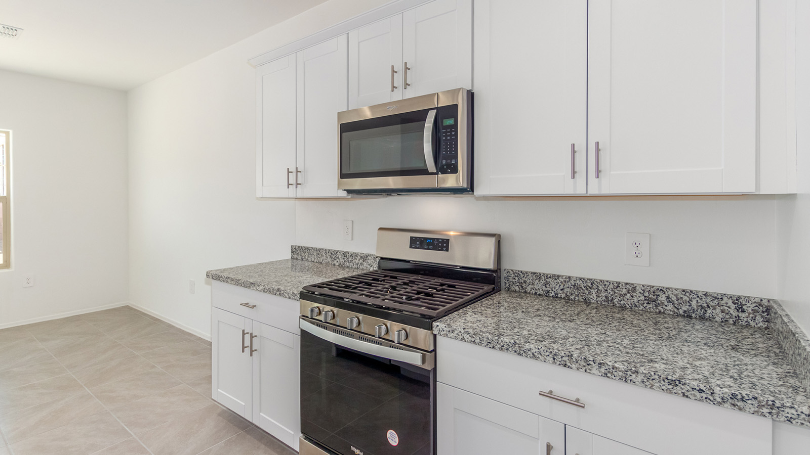 Welcome to The Grace, an intentionally designed two-story new home nestled in the Mesquite neighborhood at Saguaro Bloom, one of Marana’s most desirable communities. Offering 1,963 square feet of living space, The Grace is perfect for those who value both comfort and modern design.  As you enter through the front porch, a welcoming foyer leads you into the open-concept main floor, where the great room, dining area, and kitchen are seamlessly connected. The kitchen is a chef’s delight, featuring a central island, granite countertops, and elegant Shaker-style cabinetry available in either white or gray. The layout is designed to maximize both function and style, ensuring that whether you're preparing a meal or hosting guests, the space works for you.  Upstairs, The Grace features four spacious bedrooms, each offering privacy and ample room for relaxation. The primary suite is a highlight, offering a private retreat with a walk-in closet and an en-suite bathroom equipped with dual vanities and a spacious shower. The additional bedrooms share a luxurious bathroom, and the convenient upstairs utility room makes laundry day a breeze.  The Grace also includes a covered patio, extending your living space outdoors, perfect for enjoying the beautiful Arizona evenings. The practical design continues with a dedicated powder room on the main level, making it convenient for guests.  This home is designed with today’s homeowner in mind, incorporating smart home technology and energy-efficient features that ensure a modern lifestyle while keeping energy costs down. Large windows allow natural light to fill the space, creating a bright and airy atmosphere throughout.  Located in the vibrant Saguaro Bloom community, The Grace offers residents access to a wealth of amenities, including community pools, walking trails, and more, all set against the stunning backdrop of the Tucson Mountains. The Grace is not just a home; it's an opportunity to live in comfort and style while enjoying everything this exceptional community has to offer.