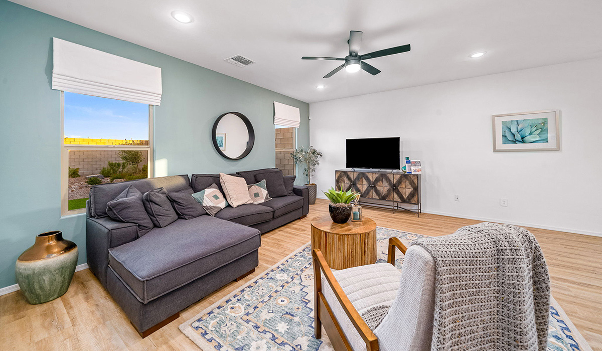 Introducing The Kate, a spacious two-story new home located in the Mesquite neighborhood at Saguaro Bloom, one of Marana's premier communities. This residence, offering 2,264 square feet of living space, is designed to accommodate a variety of lifestyles, with four bedrooms and two and a half bathrooms.  As you enter through the welcoming front porch, you’re immediately drawn into an expansive and open living area. The great room, which flows effortlessly into the dining area and kitchen, serves as the heart of the home, making it perfect for gatherings and everyday living. The kitchen is both functional and stylish, featuring a central island, quartz countertops, and Shaker-style cabinetry. A pantry provides additional storage, keeping your kitchen organized.  Upstairs, The Kate continues to impress with a layout that emphasizes comfort and convenience. The primary bedroom is a peaceful getaway, complete with a walk-in closet and ensuite bathroom. The additional three bedrooms are generously sized and share access to a full bathroom. A dedicated loft provides a flexible space that can be used as a play area, media room, or home office.  The home also includes a powder room on the main level, perfect for guests, and a large utility room upstairs, adding practicality to the daily routine. The covered patio extends your living space outdoors, ideal for enjoying the beautiful Arizona weather.  Built with modern living in mind, The Kate has energy-efficient features, ensuring comfort and sustainability for years to come. Large windows throughout the home allow natural light to brighten every corner, creating a warm and inviting atmosphere.  Situated within the vibrant Saguaro Bloom community, residents have access to many amenities, including swimming pools, walking trails, and parks.   *Images shown are for reference only. They depict the sales model home and may not represent the actual home.