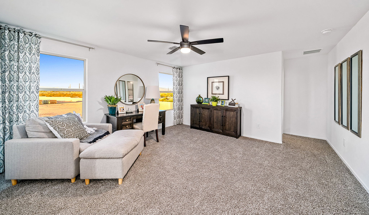 Introducing The Kate, a spacious two-story new home located in the Mesquite neighborhood at Saguaro Bloom, one of Marana's premier communities. This residence, offering 2,264 square feet of living space, is designed to accommodate a variety of lifestyles, with four bedrooms and two and a half bathrooms.  As you enter through the welcoming front porch, you’re immediately drawn into an expansive and open living area. The great room, which flows effortlessly into the dining area and kitchen, serves as the heart of the home, making it perfect for gatherings and everyday living. The kitchen is both functional and stylish, featuring a central island, quartz countertops, and Shaker-style cabinetry. A pantry provides additional storage, keeping your kitchen organized.  Upstairs, The Kate continues to impress with a layout that emphasizes comfort and convenience. The primary bedroom is a peaceful getaway, complete with a walk-in closet and ensuite bathroom. The additional three bedrooms are generously sized and share access to a full bathroom. A dedicated loft provides a flexible space that can be used as a play area, media room, or home office.  The home also includes a powder room on the main level, perfect for guests, and a large utility room upstairs, adding practicality to the daily routine. The covered patio extends your living space outdoors, ideal for enjoying the beautiful Arizona weather.  Built with modern living in mind, The Kate has energy-efficient features, ensuring comfort and sustainability for years to come. Large windows throughout the home allow natural light to brighten every corner, creating a warm and inviting atmosphere.  Situated within the vibrant Saguaro Bloom community, residents have access to many amenities, including swimming pools, walking trails, and parks.   *Images shown are for reference only. They depict the sales model home and may not represent the actual home.