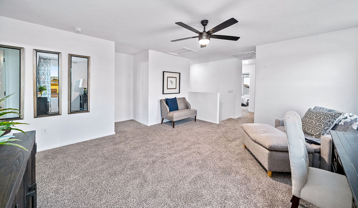 Introducing The Kate, a spacious two-story new home located in the Mesquite neighborhood at Saguaro Bloom, one of Marana's premier communities. This residence, offering 2,264 square feet of living space, is designed to accommodate a variety of lifestyles, with four bedrooms and two and a half bathrooms.  As you enter through the welcoming front porch, you’re immediately drawn into an expansive and open living area. The great room, which flows effortlessly into the dining area and kitchen, serves as the heart of the home, making it perfect for gatherings and everyday living. The kitchen is both functional and stylish, featuring a central island, quartz countertops, and Shaker-style cabinetry. A pantry provides additional storage, keeping your kitchen organized.  Upstairs, The Kate continues to impress with a layout that emphasizes comfort and convenience. The primary bedroom is a peaceful getaway, complete with a walk-in closet and ensuite bathroom. The additional three bedrooms are generously sized and share access to a full bathroom. A dedicated loft provides a flexible space that can be used as a play area, media room, or home office.  The home also includes a powder room on the main level, perfect for guests, and a large utility room upstairs, adding practicality to the daily routine. The covered patio extends your living space outdoors, ideal for enjoying the beautiful Arizona weather.  Built with modern living in mind, The Kate has energy-efficient features, ensuring comfort and sustainability for years to come. Large windows throughout the home allow natural light to brighten every corner, creating a warm and inviting atmosphere.  Situated within the vibrant Saguaro Bloom community, residents have access to many amenities, including swimming pools, walking trails, and parks.   *Images shown are for reference only. They depict the sales model home and may not represent the actual home.