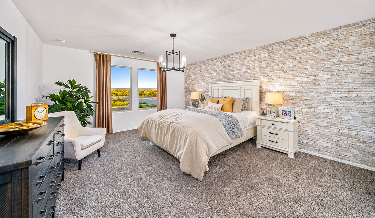 Introducing The Kate, a spacious two-story new home located in the Mesquite neighborhood at Saguaro Bloom, one of Marana's premier communities. This residence, offering 2,264 square feet of living space, is designed to accommodate a variety of lifestyles, with four bedrooms and two and a half bathrooms.  As you enter through the welcoming front porch, you’re immediately drawn into an expansive and open living area. The great room, which flows effortlessly into the dining area and kitchen, serves as the heart of the home, making it perfect for gatherings and everyday living. The kitchen is both functional and stylish, featuring a central island, quartz countertops, and Shaker-style cabinetry. A pantry provides additional storage, keeping your kitchen organized.  Upstairs, The Kate continues to impress with a layout that emphasizes comfort and convenience. The primary bedroom is a peaceful getaway, complete with a walk-in closet and ensuite bathroom. The additional three bedrooms are generously sized and share access to a full bathroom. A dedicated loft provides a flexible space that can be used as a play area, media room, or home office.  The home also includes a powder room on the main level, perfect for guests, and a large utility room upstairs, adding practicality to the daily routine. The covered patio extends your living space outdoors, ideal for enjoying the beautiful Arizona weather.  Built with modern living in mind, The Kate has energy-efficient features, ensuring comfort and sustainability for years to come. Large windows throughout the home allow natural light to brighten every corner, creating a warm and inviting atmosphere.  Situated within the vibrant Saguaro Bloom community, residents have access to many amenities, including swimming pools, walking trails, and parks.   *Images shown are for reference only. They depict the sales model home and may not represent the actual home.