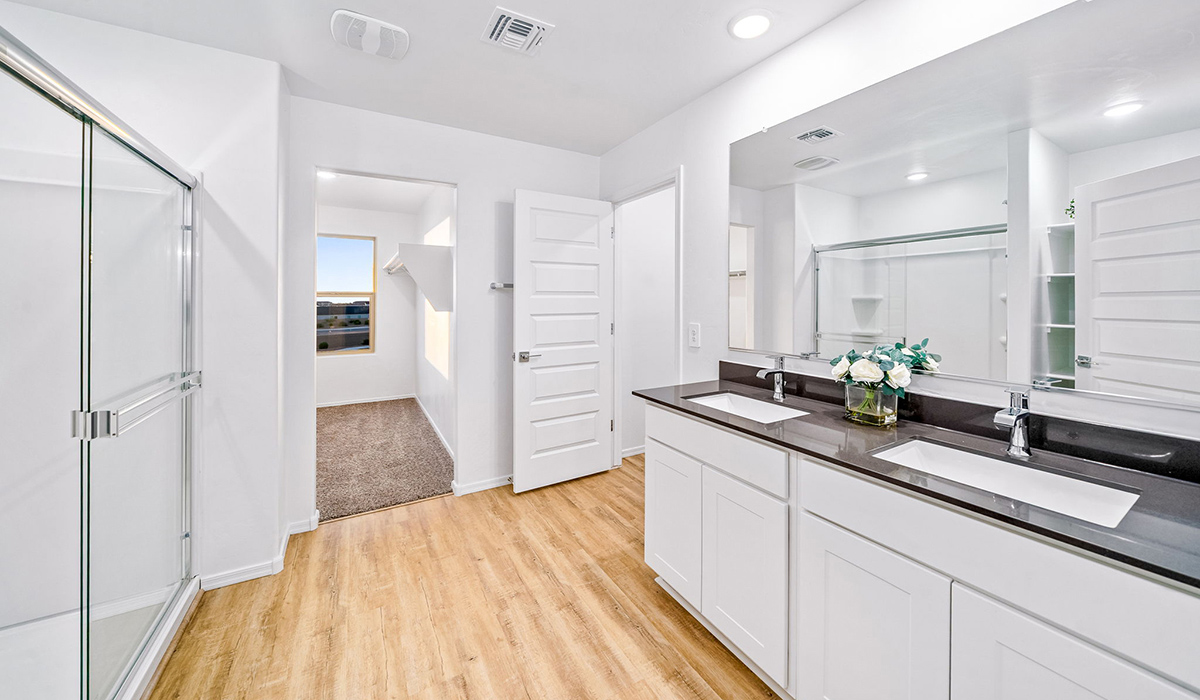 Introducing The Kate, a spacious two-story new home located in the Mesquite neighborhood at Saguaro Bloom, one of Marana's premier communities. This residence, offering 2,264 square feet of living space, is designed to accommodate a variety of lifestyles, with four bedrooms and two and a half bathrooms.  As you enter through the welcoming front porch, you’re immediately drawn into an expansive and open living area. The great room, which flows effortlessly into the dining area and kitchen, serves as the heart of the home, making it perfect for gatherings and everyday living. The kitchen is both functional and stylish, featuring a central island, quartz countertops, and Shaker-style cabinetry. A pantry provides additional storage, keeping your kitchen organized.  Upstairs, The Kate continues to impress with a layout that emphasizes comfort and convenience. The primary bedroom is a peaceful getaway, complete with a walk-in closet and ensuite bathroom. The additional three bedrooms are generously sized and share access to a full bathroom. A dedicated loft provides a flexible space that can be used as a play area, media room, or home office.  The home also includes a powder room on the main level, perfect for guests, and a large utility room upstairs, adding practicality to the daily routine. The covered patio extends your living space outdoors, ideal for enjoying the beautiful Arizona weather.  Built with modern living in mind, The Kate has energy-efficient features, ensuring comfort and sustainability for years to come. Large windows throughout the home allow natural light to brighten every corner, creating a warm and inviting atmosphere.  Situated within the vibrant Saguaro Bloom community, residents have access to many amenities, including swimming pools, walking trails, and parks.   *Images shown are for reference only. They depict the sales model home and may not represent the actual home.