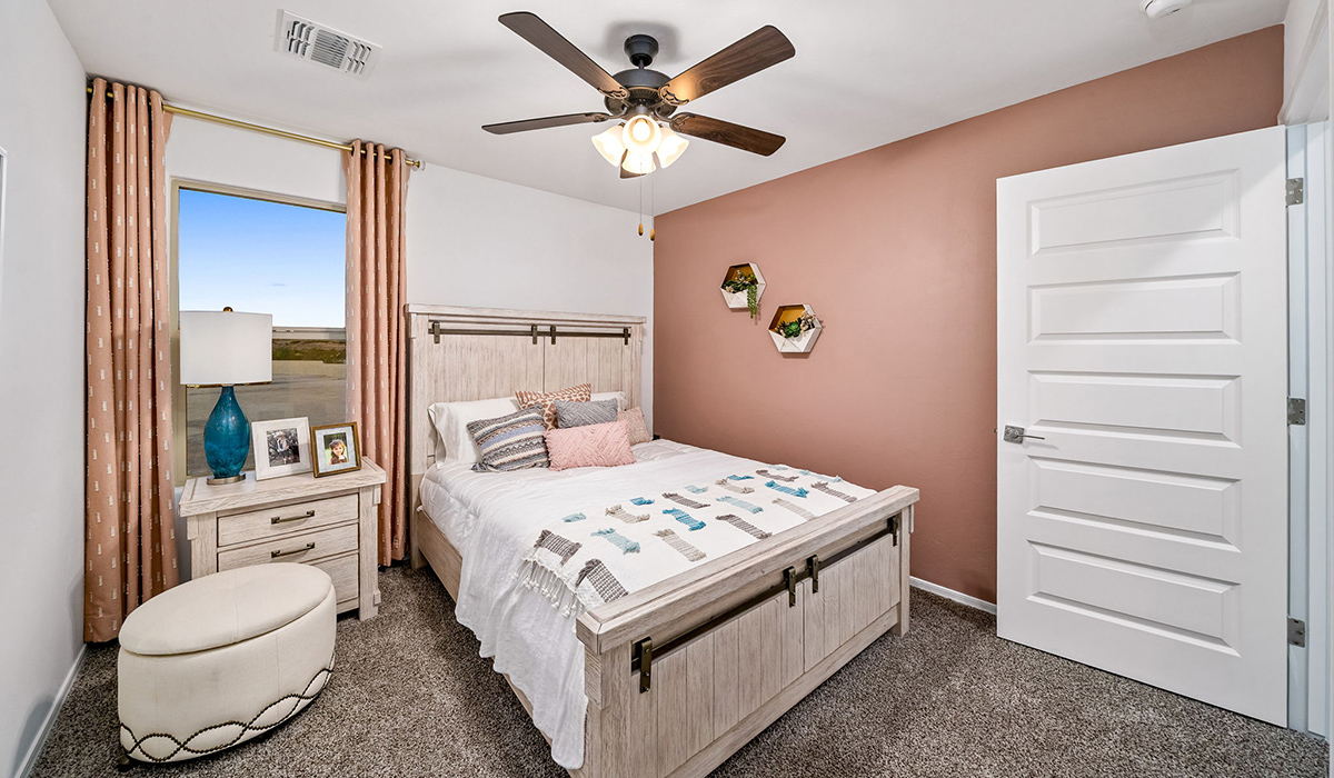 Introducing The Kate, a spacious two-story new home located in the Mesquite neighborhood at Saguaro Bloom, one of Marana's premier communities. This residence, offering 2,264 square feet of living space, is designed to accommodate a variety of lifestyles, with four bedrooms and two and a half bathrooms.  As you enter through the welcoming front porch, you’re immediately drawn into an expansive and open living area. The great room, which flows effortlessly into the dining area and kitchen, serves as the heart of the home, making it perfect for gatherings and everyday living. The kitchen is both functional and stylish, featuring a central island, quartz countertops, and Shaker-style cabinetry. A pantry provides additional storage, keeping your kitchen organized.  Upstairs, The Kate continues to impress with a layout that emphasizes comfort and convenience. The primary bedroom is a peaceful getaway, complete with a walk-in closet and ensuite bathroom. The additional three bedrooms are generously sized and share access to a full bathroom. A dedicated loft provides a flexible space that can be used as a play area, media room, or home office.  The home also includes a powder room on the main level, perfect for guests, and a large utility room upstairs, adding practicality to the daily routine. The covered patio extends your living space outdoors, ideal for enjoying the beautiful Arizona weather.  Built with modern living in mind, The Kate has energy-efficient features, ensuring comfort and sustainability for years to come. Large windows throughout the home allow natural light to brighten every corner, creating a warm and inviting atmosphere.  Situated within the vibrant Saguaro Bloom community, residents have access to many amenities, including swimming pools, walking trails, and parks.   *Images shown are for reference only. They depict the sales model home and may not represent the actual home.