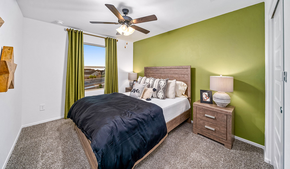 Introducing The Kate, a spacious two-story new home located in the Mesquite neighborhood at Saguaro Bloom, one of Marana's premier communities. This residence, offering 2,264 square feet of living space, is designed to accommodate a variety of lifestyles, with four bedrooms and two and a half bathrooms.  As you enter through the welcoming front porch, you’re immediately drawn into an expansive and open living area. The great room, which flows effortlessly into the dining area and kitchen, serves as the heart of the home, making it perfect for gatherings and everyday living. The kitchen is both functional and stylish, featuring a central island, quartz countertops, and Shaker-style cabinetry. A pantry provides additional storage, keeping your kitchen organized.  Upstairs, The Kate continues to impress with a layout that emphasizes comfort and convenience. The primary bedroom is a peaceful getaway, complete with a walk-in closet and ensuite bathroom. The additional three bedrooms are generously sized and share access to a full bathroom. A dedicated loft provides a flexible space that can be used as a play area, media room, or home office.  The home also includes a powder room on the main level, perfect for guests, and a large utility room upstairs, adding practicality to the daily routine. The covered patio extends your living space outdoors, ideal for enjoying the beautiful Arizona weather.  Built with modern living in mind, The Kate has energy-efficient features, ensuring comfort and sustainability for years to come. Large windows throughout the home allow natural light to brighten every corner, creating a warm and inviting atmosphere.  Situated within the vibrant Saguaro Bloom community, residents have access to many amenities, including swimming pools, walking trails, and parks.   *Images shown are for reference only. They depict the sales model home and may not represent the actual home.