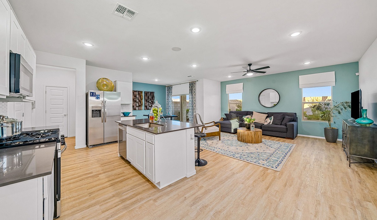Introducing The Kate, a spacious two-story new home located in the Mesquite neighborhood at Saguaro Bloom, one of Marana's premier communities. This residence, offering 2,264 square feet of living space, is designed to accommodate a variety of lifestyles, with four bedrooms and two and a half bathrooms.  As you enter through the welcoming front porch, you’re immediately drawn into an expansive and open living area. The great room, which flows effortlessly into the dining area and kitchen, serves as the heart of the home, making it perfect for gatherings and everyday living. The kitchen is both functional and stylish, featuring a central island, quartz countertops, and Shaker-style cabinetry. A pantry provides additional storage, keeping your kitchen organized.  Upstairs, The Kate continues to impress with a layout that emphasizes comfort and convenience. The primary bedroom is a peaceful getaway, complete with a walk-in closet and ensuite bathroom. The additional three bedrooms are generously sized and share access to a full bathroom. A dedicated loft provides a flexible space that can be used as a play area, media room, or home office.  The home also includes a powder room on the main level, perfect for guests, and a large utility room upstairs, adding practicality to the daily routine. The covered patio extends your living space outdoors, ideal for enjoying the beautiful Arizona weather.  Built with modern living in mind, The Kate has energy-efficient features, ensuring comfort and sustainability for years to come. Large windows throughout the home allow natural light to brighten every corner, creating a warm and inviting atmosphere.  Situated within the vibrant Saguaro Bloom community, residents have access to many amenities, including swimming pools, walking trails, and parks.   *Images shown are for reference only. They depict the sales model home and may not represent the actual home.