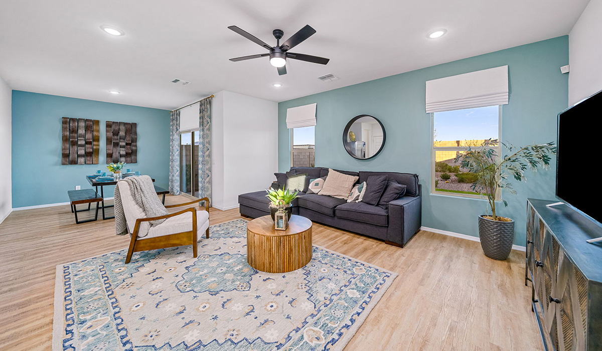 Introducing The Kate, a spacious two-story new home located in the Mesquite neighborhood at Saguaro Bloom, one of Marana's premier communities. This residence, offering 2,264 square feet of living space, is designed to accommodate a variety of lifestyles, with four bedrooms and two and a half bathrooms.  As you enter through the welcoming front porch, you’re immediately drawn into an expansive and open living area. The great room, which flows effortlessly into the dining area and kitchen, serves as the heart of the home, making it perfect for gatherings and everyday living. The kitchen is both functional and stylish, featuring a central island, quartz countertops, and Shaker-style cabinetry. A pantry provides additional storage, keeping your kitchen organized.  Upstairs, The Kate continues to impress with a layout that emphasizes comfort and convenience. The primary bedroom is a peaceful getaway, complete with a walk-in closet and ensuite bathroom. The additional three bedrooms are generously sized and share access to a full bathroom. A dedicated loft provides a flexible space that can be used as a play area, media room, or home office.  The home also includes a powder room on the main level, perfect for guests, and a large utility room upstairs, adding practicality to the daily routine. The covered patio extends your living space outdoors, ideal for enjoying the beautiful Arizona weather.  Built with modern living in mind, The Kate has energy-efficient features, ensuring comfort and sustainability for years to come. Large windows throughout the home allow natural light to brighten every corner, creating a warm and inviting atmosphere.  Situated within the vibrant Saguaro Bloom community, residents have access to many amenities, including swimming pools, walking trails, and parks.   *Images shown are for reference only. They depict the sales model home and may not represent the actual home.