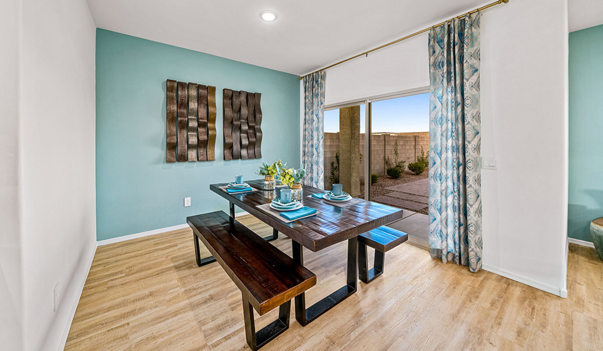 Introducing The Kate, a spacious two-story new home located in the Mesquite neighborhood at Saguaro Bloom, one of Marana's premier communities. This residence, offering 2,264 square feet of living space, is designed to accommodate a variety of lifestyles, with four bedrooms and two and a half bathrooms.  As you enter through the welcoming front porch, you’re immediately drawn into an expansive and open living area. The great room, which flows effortlessly into the dining area and kitchen, serves as the heart of the home, making it perfect for gatherings and everyday living. The kitchen is both functional and stylish, featuring a central island, quartz countertops, and Shaker-style cabinetry. A pantry provides additional storage, keeping your kitchen organized.  Upstairs, The Kate continues to impress with a layout that emphasizes comfort and convenience. The primary bedroom is a peaceful getaway, complete with a walk-in closet and ensuite bathroom. The additional three bedrooms are generously sized and share access to a full bathroom. A dedicated loft provides a flexible space that can be used as a play area, media room, or home office.  The home also includes a powder room on the main level, perfect for guests, and a large utility room upstairs, adding practicality to the daily routine. The covered patio extends your living space outdoors, ideal for enjoying the beautiful Arizona weather.  Built with modern living in mind, The Kate has energy-efficient features, ensuring comfort and sustainability for years to come. Large windows throughout the home allow natural light to brighten every corner, creating a warm and inviting atmosphere.  Situated within the vibrant Saguaro Bloom community, residents have access to many amenities, including swimming pools, walking trails, and parks.   *Images shown are for reference only. They depict the sales model home and may not represent the actual home.