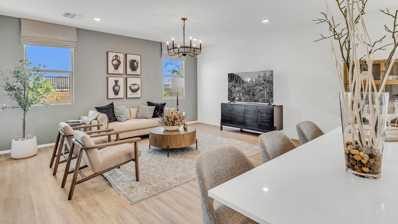 Introducing The Kate, a spacious two-story new home located in the Mesquite neighborhood at Saguaro Bloom, one of Marana's premier communities. This residence, offering 2,264 square feet of living space, is designed to accommodate a variety of lifestyles, with four bedrooms and two and a half bathrooms.  As you enter through the welcoming front porch, you’re immediately drawn into an expansive and open living area. The great room, which flows effortlessly into the dining area and kitchen, serves as the heart of the home, making it perfect for gatherings and everyday living. The kitchen is both functional and stylish, featuring a central island, granite countertops, and Shaker-style cabinetry in your choice of white or gray. A pantry provides additional storage, keeping your kitchen organized and clutter-free.  Upstairs, The Kate continues to impress with a layout that emphasizes comfort and convenience. The primary bedroom is a peaceful getaway, complete with a walk-in closet and a private bathroom featuring dual sinks. The additional three bedrooms are generously sized and share access to a full bathroom. A dedicated game room provides flexible space that can be used as a play area, media room, or home office.  The home also includes a powder room on the main level, perfect for guests, and a large utility room upstairs, adding practicality to the daily routine. The covered patio extends your living space outdoors, ideal for enjoying the beautiful Arizona weather or entertaining guests.  Built with modern living in mind, The Kate incorporates energy-efficient features and smart home technology, ensuring comfort and sustainability for years to come. Large windows throughout the home allow natural light to brighten every corner, creating a warm and inviting atmosphere.  Situated within the vibrant Saguaro Bloom community, residents of The Kate enjoy access to a wealth of amenities, including swimming pools, walking trails, parks, and more. This home offers the perfect blend of style, comfort, and community, making it a standout choice in the Marana area.  *Images shown are for reference only. They depict the sales model home and may not represent the actual home.