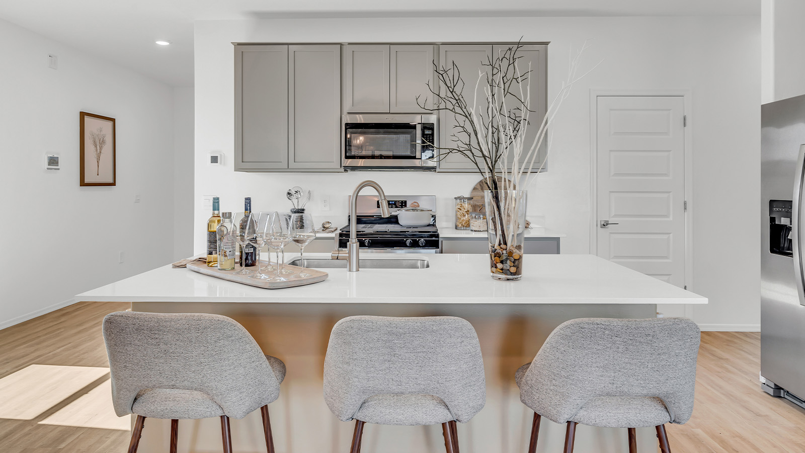 Introducing The Kate, a spacious two-story new home located in the Mesquite neighborhood at Saguaro Bloom, one of Marana's premier communities. This residence, offering 2,264 square feet of living space, is designed to accommodate a variety of lifestyles, with four bedrooms and two and a half bathrooms.  As you enter through the welcoming front porch, you’re immediately drawn into an expansive and open living area. The great room, which flows effortlessly into the dining area and kitchen, serves as the heart of the home, making it perfect for gatherings and everyday living. The kitchen is both functional and stylish, featuring a central island, granite countertops, and Shaker-style cabinetry in your choice of white or gray. A pantry provides additional storage, keeping your kitchen organized and clutter-free.  Upstairs, The Kate continues to impress with a layout that emphasizes comfort and convenience. The primary bedroom is a peaceful getaway, complete with a walk-in closet and a private bathroom featuring dual sinks. The additional three bedrooms are generously sized and share access to a full bathroom. A dedicated game room provides flexible space that can be used as a play area, media room, or home office.  The home also includes a powder room on the main level, perfect for guests, and a large utility room upstairs, adding practicality to the daily routine. The covered patio extends your living space outdoors, ideal for enjoying the beautiful Arizona weather or entertaining guests.  Built with modern living in mind, The Kate incorporates energy-efficient features and smart home technology, ensuring comfort and sustainability for years to come. Large windows throughout the home allow natural light to brighten every corner, creating a warm and inviting atmosphere.  Situated within the vibrant Saguaro Bloom community, residents of The Kate enjoy access to a wealth of amenities, including swimming pools, walking trails, parks, and more. This home offers the perfect blend of style, comfort, and community, making it a standout choice in the Marana area.  *Images shown are for reference only. They depict the sales model home and may not represent the actual home.